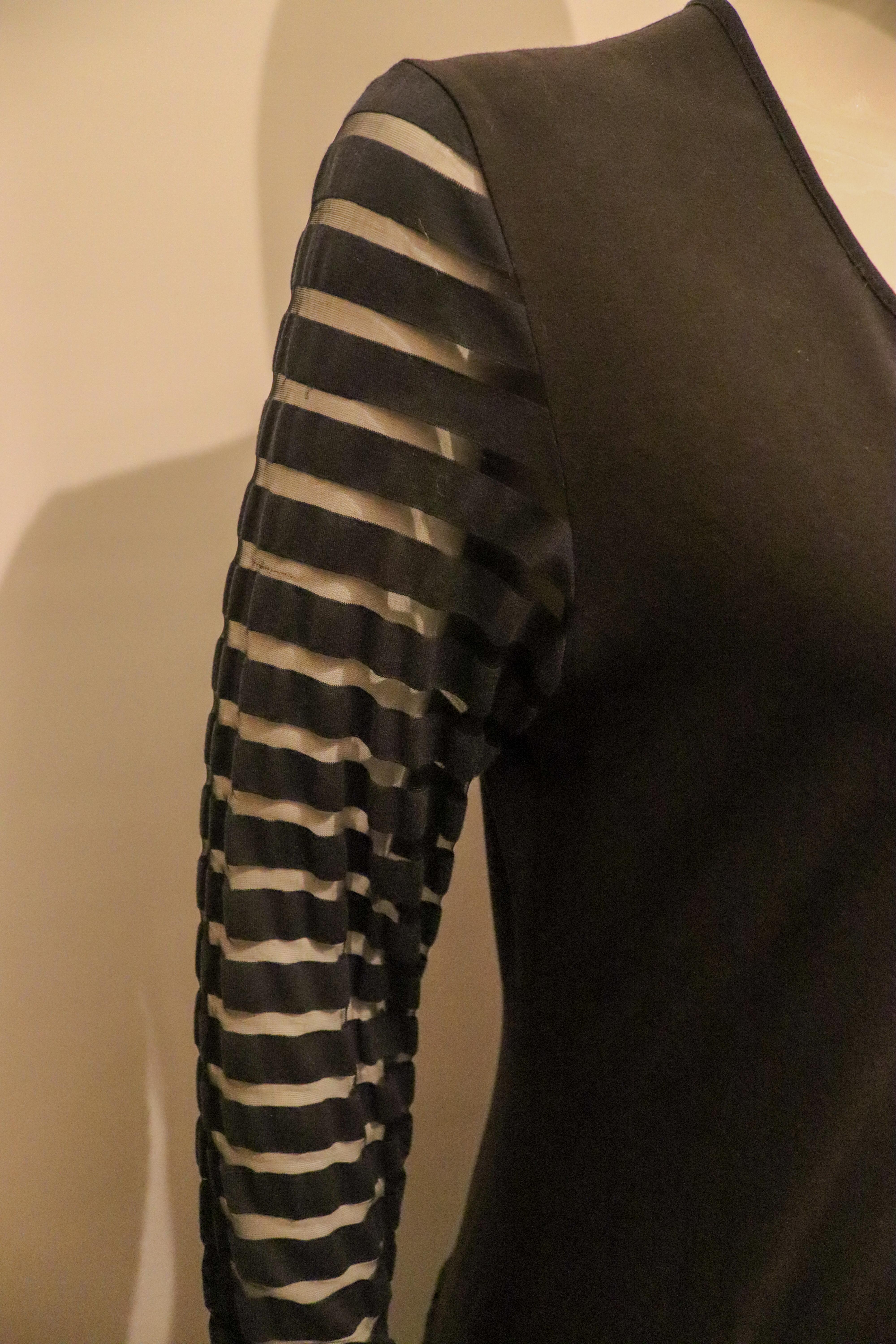 Yves Saint Laurent Black Dress with Interesting Sleave and Hem detail In Good Condition For Sale In London, GB