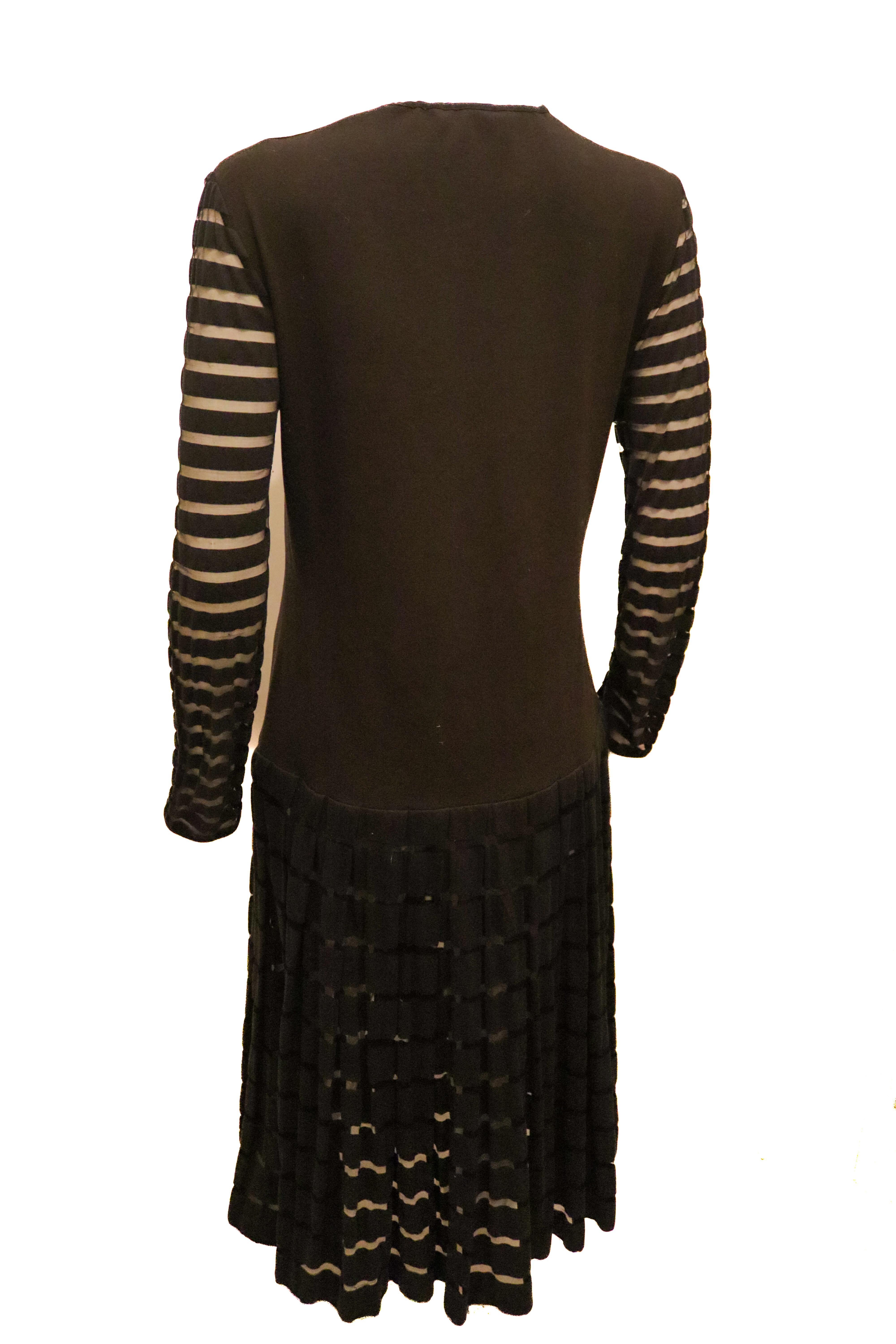 Yves Saint Laurent Black Dress with Interesting Sleave and Hem detail For Sale 1