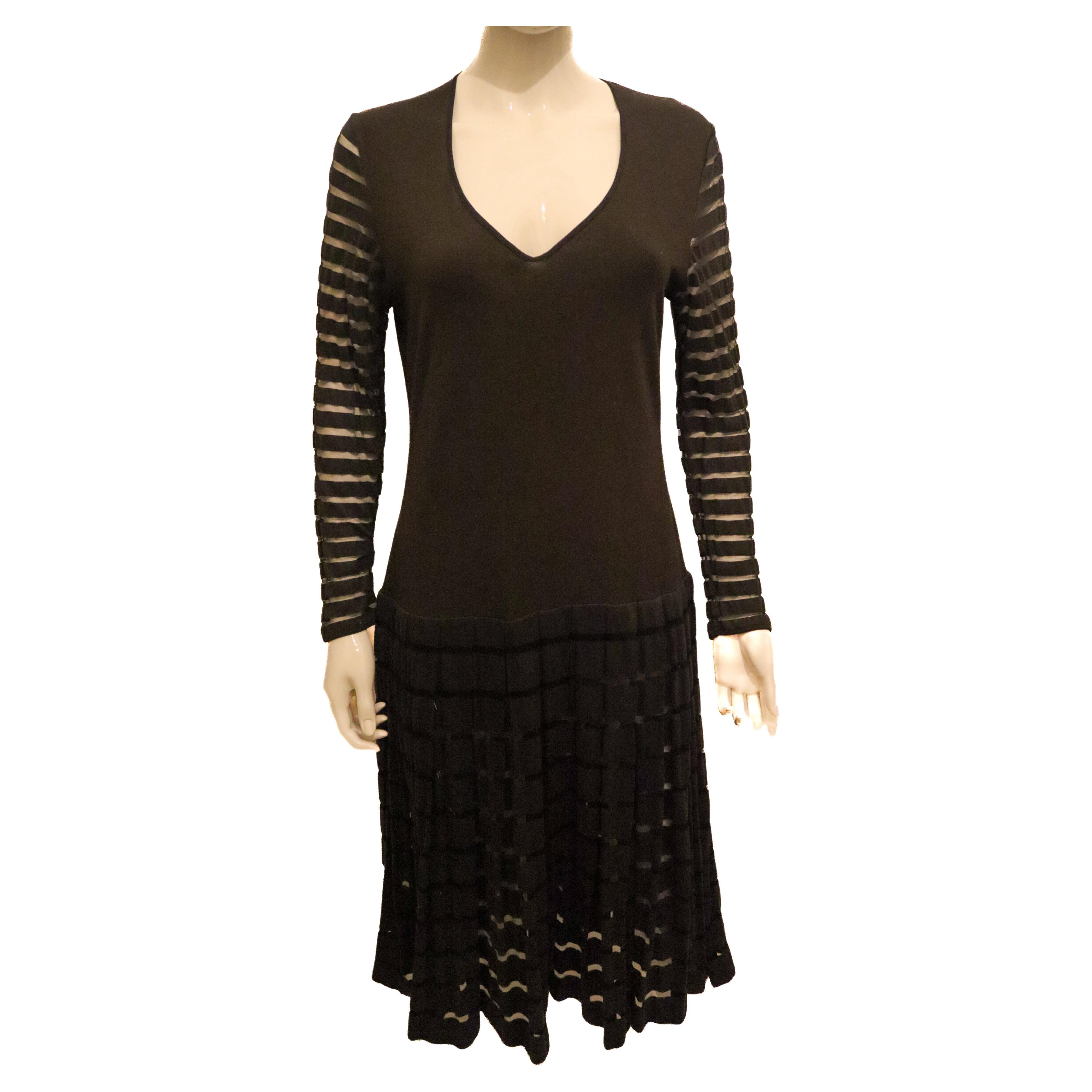 Yves Saint Laurent Black Dress with Interesting Sleave and Hem detail For Sale