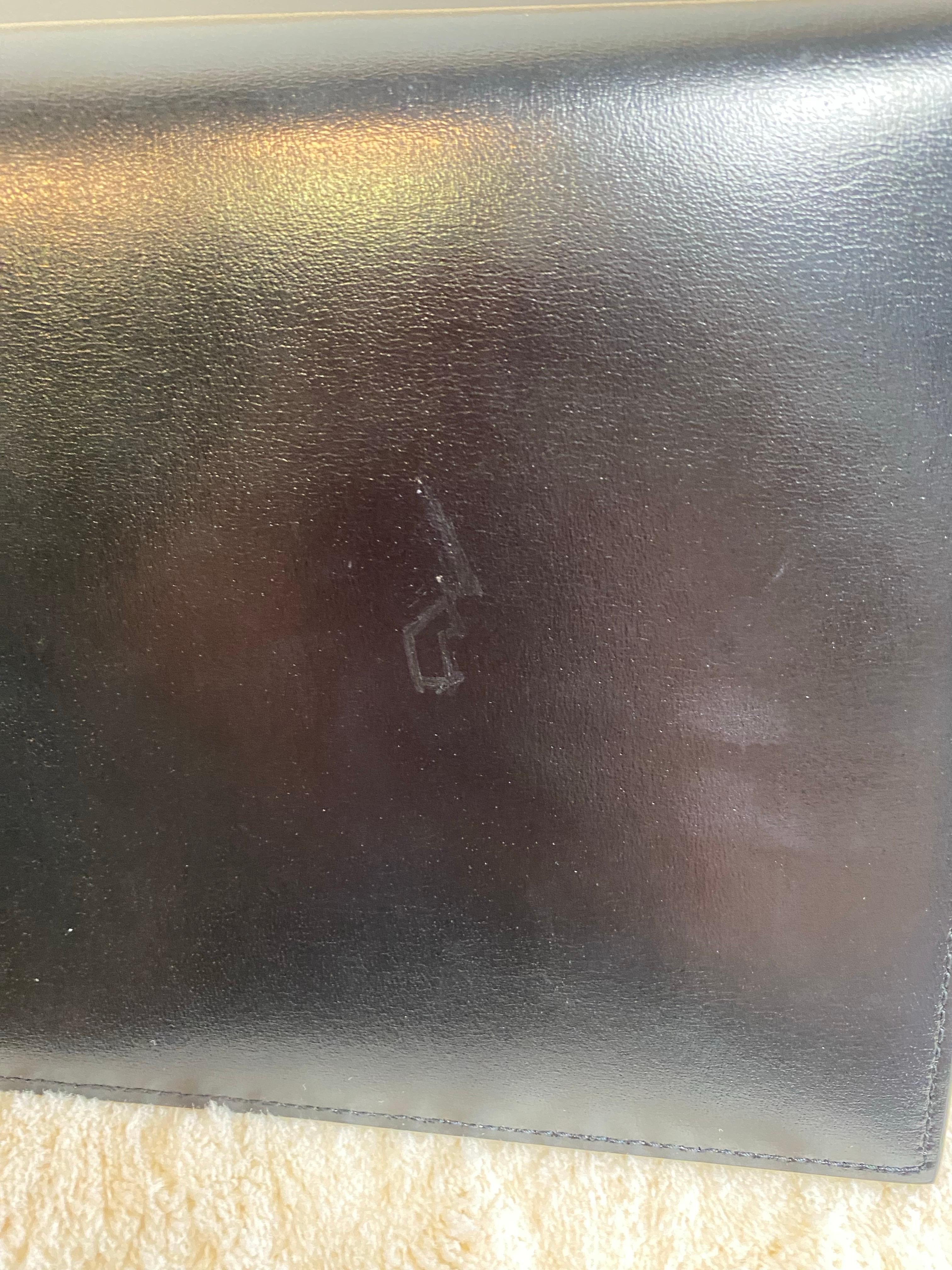 Yves Saint Laurent black envelope. For Sale 1