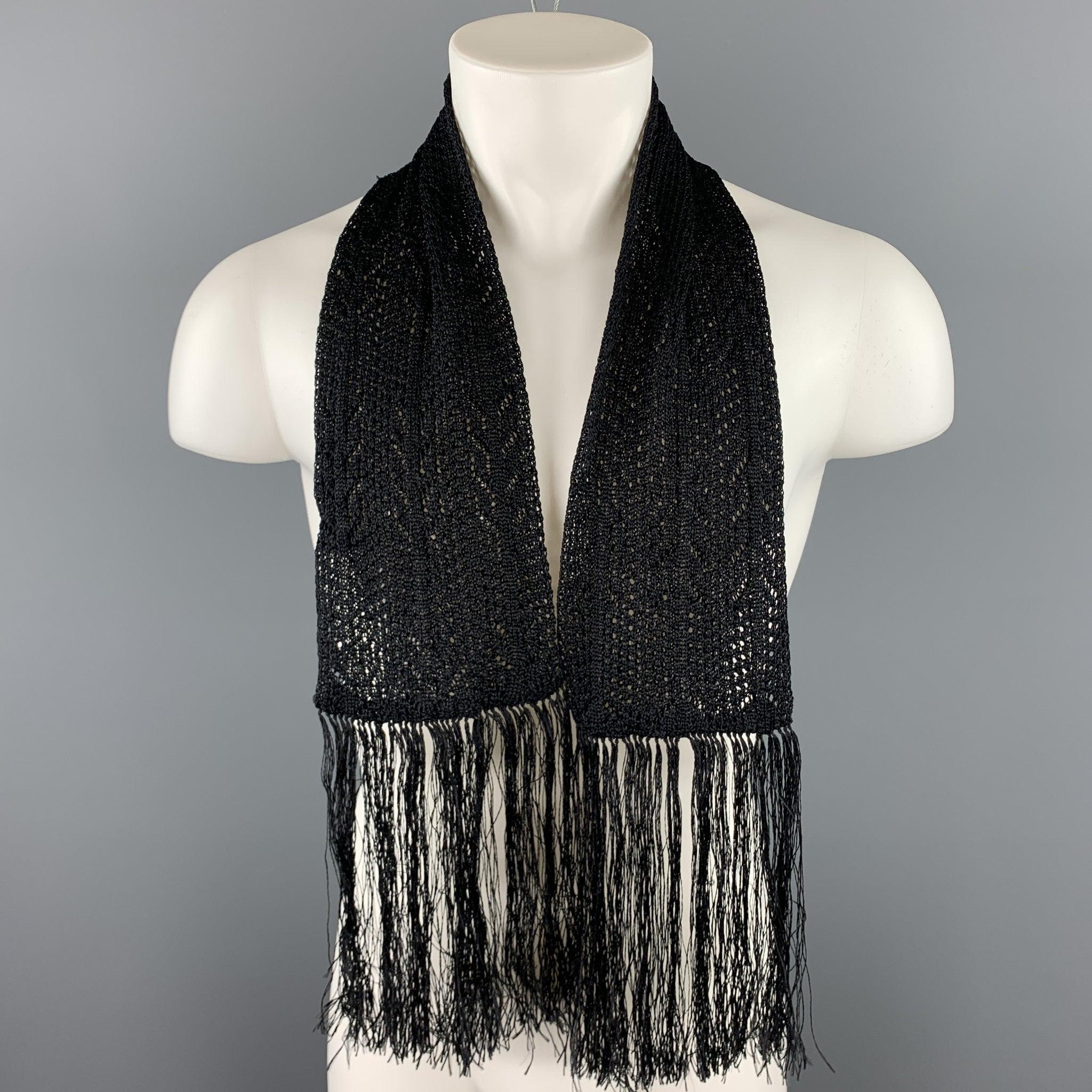 YVES SAINT LAURENT scarf comes in a black knitted silk with a eight inch fringe trim. Made in Italy.Very Good Pre-Owned Condition.
  
 

 Measurements: 
  6 inches x 48 inches 
  
  
  
 Sui Generis Reference: 105121
 Category: Scarves
 More