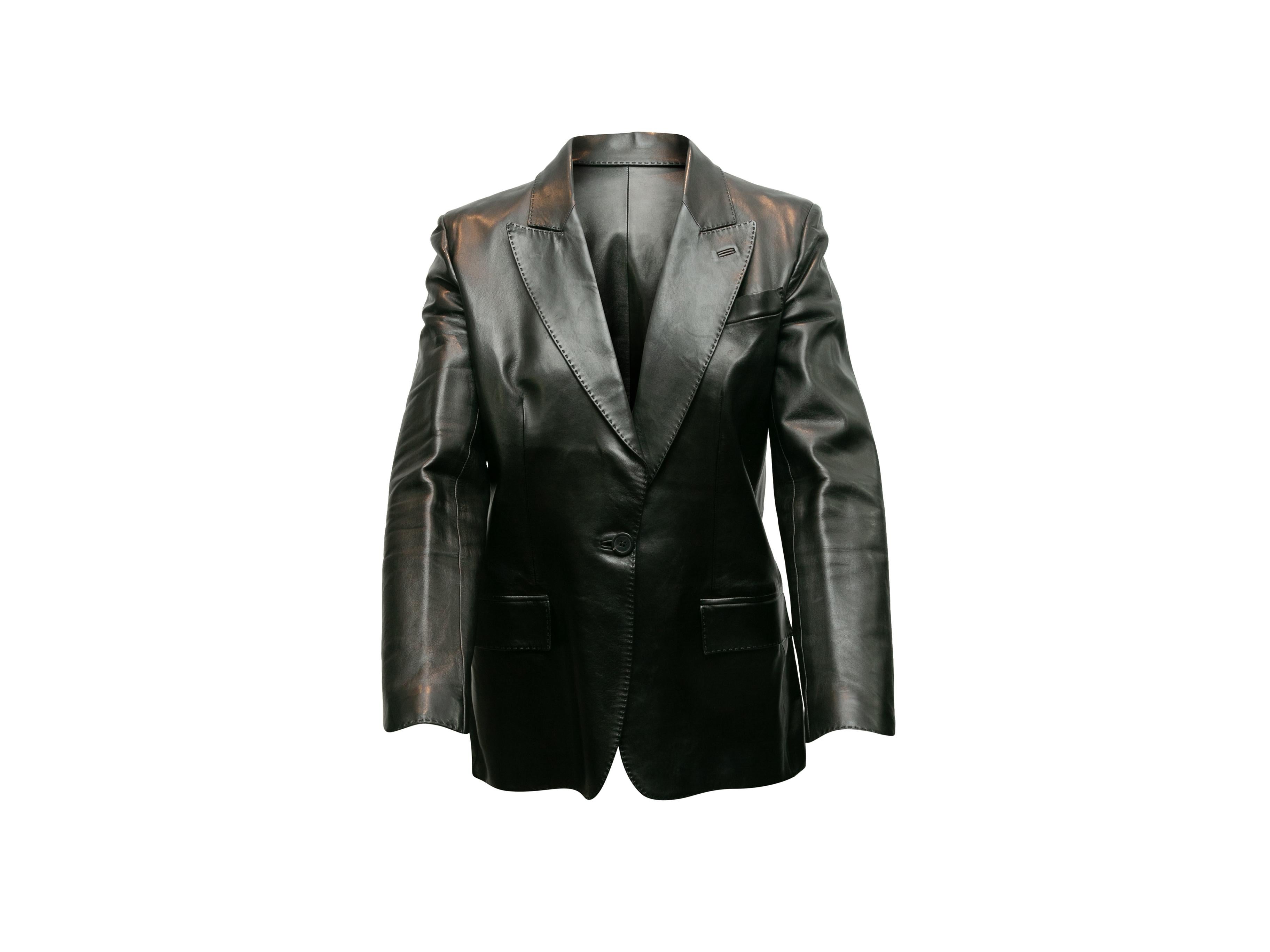 Product details: Vintage black leather blazer by Yves Saint Laurent. Peaked lapel. Single welt pocket at bust. Dual hip pockets. Button closure at front. Designer size 40. 36