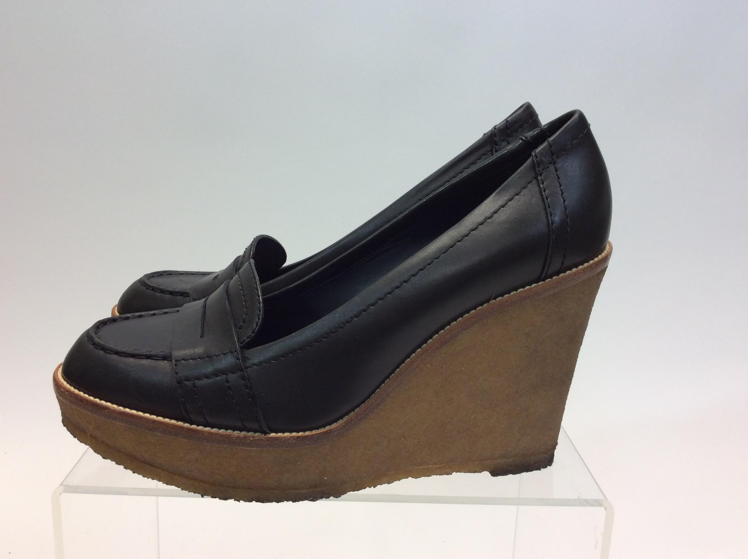 Yves Saint Laurent Black Leather Wedges
$225
Made in Italy
Leather
Size 40
1” platform 
4.5” heel