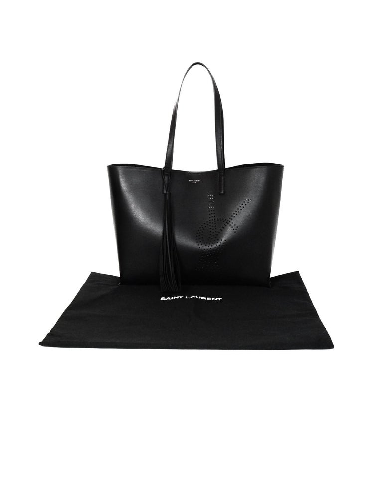 Yves Saint Laurent Black Leather YSL Perforated Shopping Tote Bag W/ Tassel  For Sale at 1stDibs | ysl perforated tote, ysl perforated tote bag, saint  laurent perforated tote