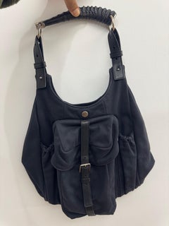 Yves Saint Laurent Black mombasa Sculptural Horn Handle & Buckled Front Pocket