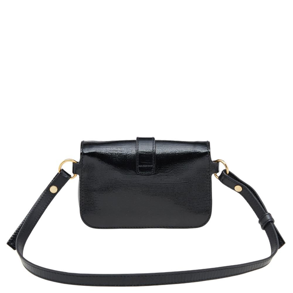 Coming from the House of Yves Saint Laurent, this mini Chyc belt bag is truly a cute and classy accessory you need to own today! It is created from black leather, with a gold-tone Y accent placed on the front. It opens to a suede-fabric interior and
