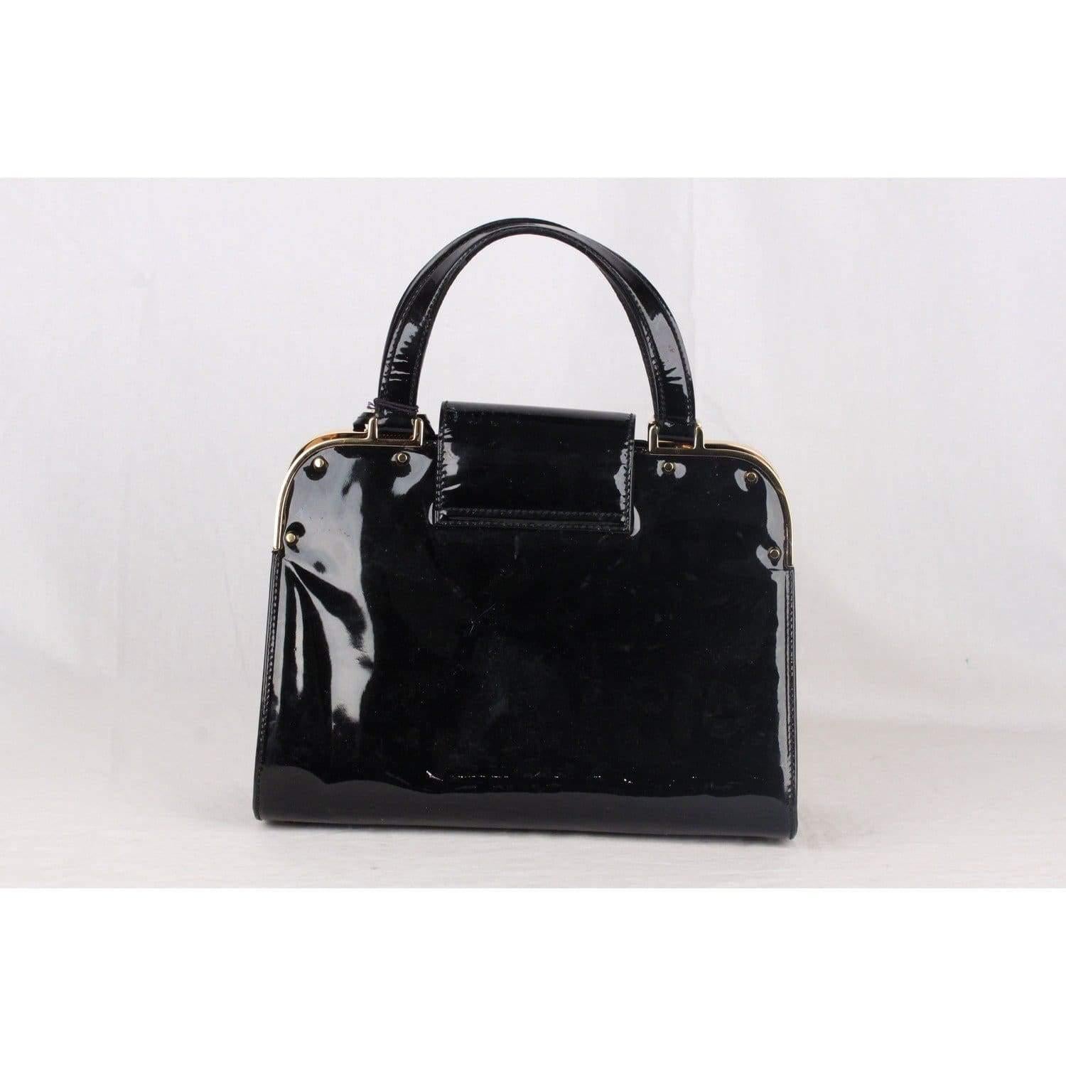 MATERIAL: Patent Leather COLOR: Black MODEL: Satchel GENDER: For Her SIZE: Medium CONDITION RATING: B :GOOD CONDITION - Some light wear of use. CONDITION DETAILS: Some small white spots/marks on the foldover flap, Some white marks/scartches on