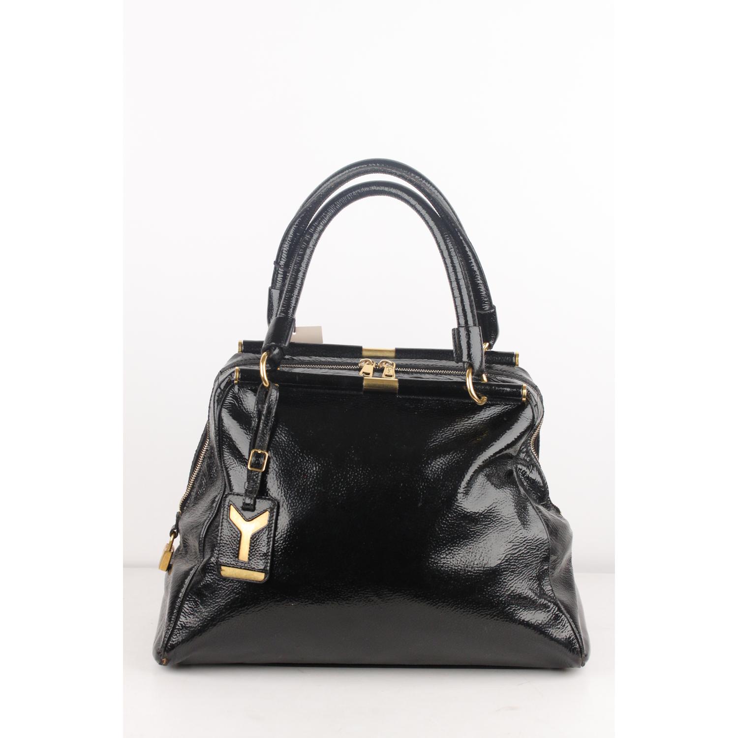 We offer Certificate of Authenticity provided by Entrupy for this item at no further cost.

Yves Saint Laurent 'Majorelle' bag in black patent leather, from Fall 2008 collection. It feature gold metal hardware, 2 metal frame rods, YSL luggage tag