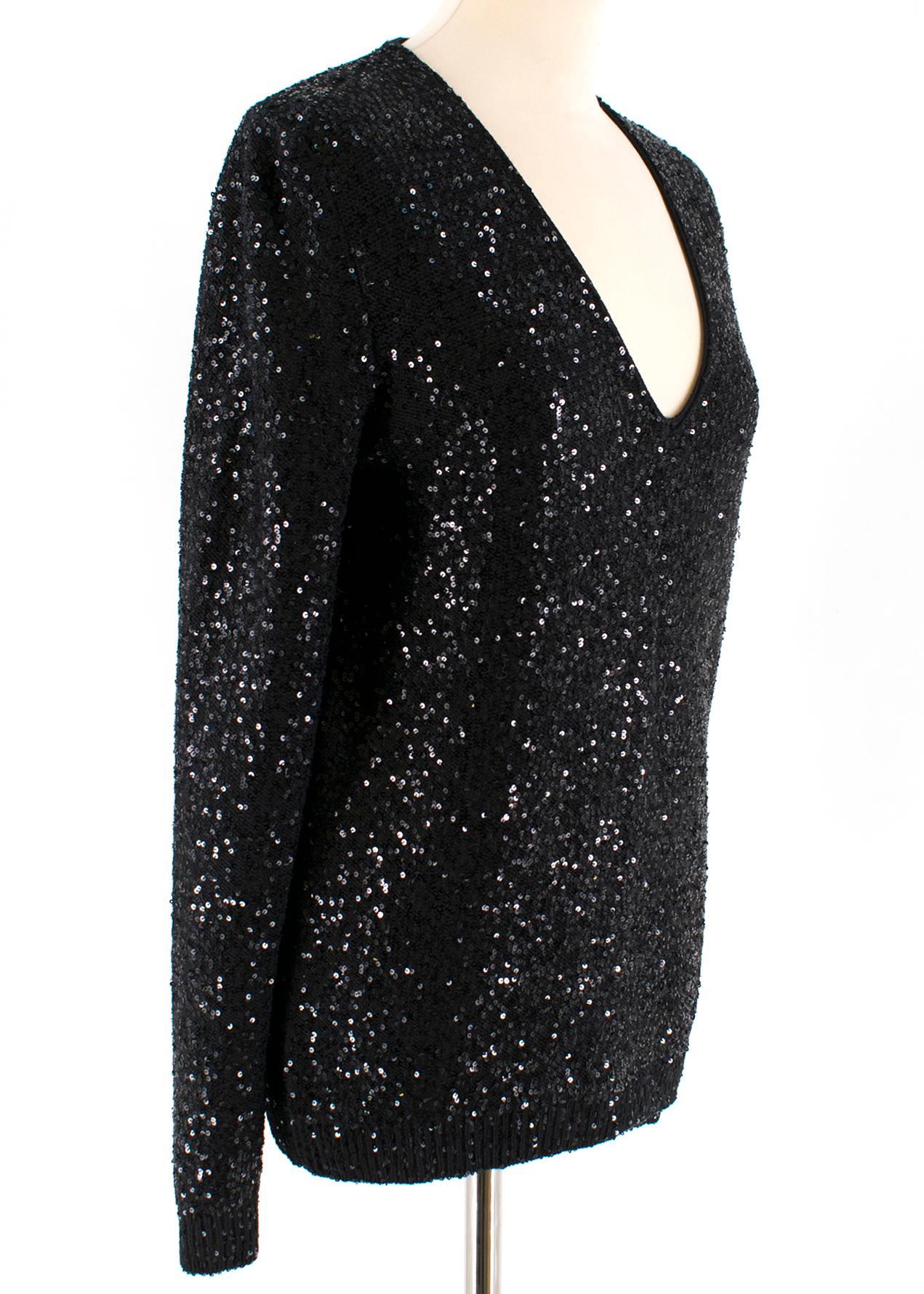 Yves Saint Laurent Black Sequin-Embellished Wool Sweater

Black Sequin knitted jumper
Long sleeves 
Low cut V-neck 
Ribbed hem and cuffs
Heavy weight wool knit

 Please note, these items are pre-owned and may show some signs of storage, even when