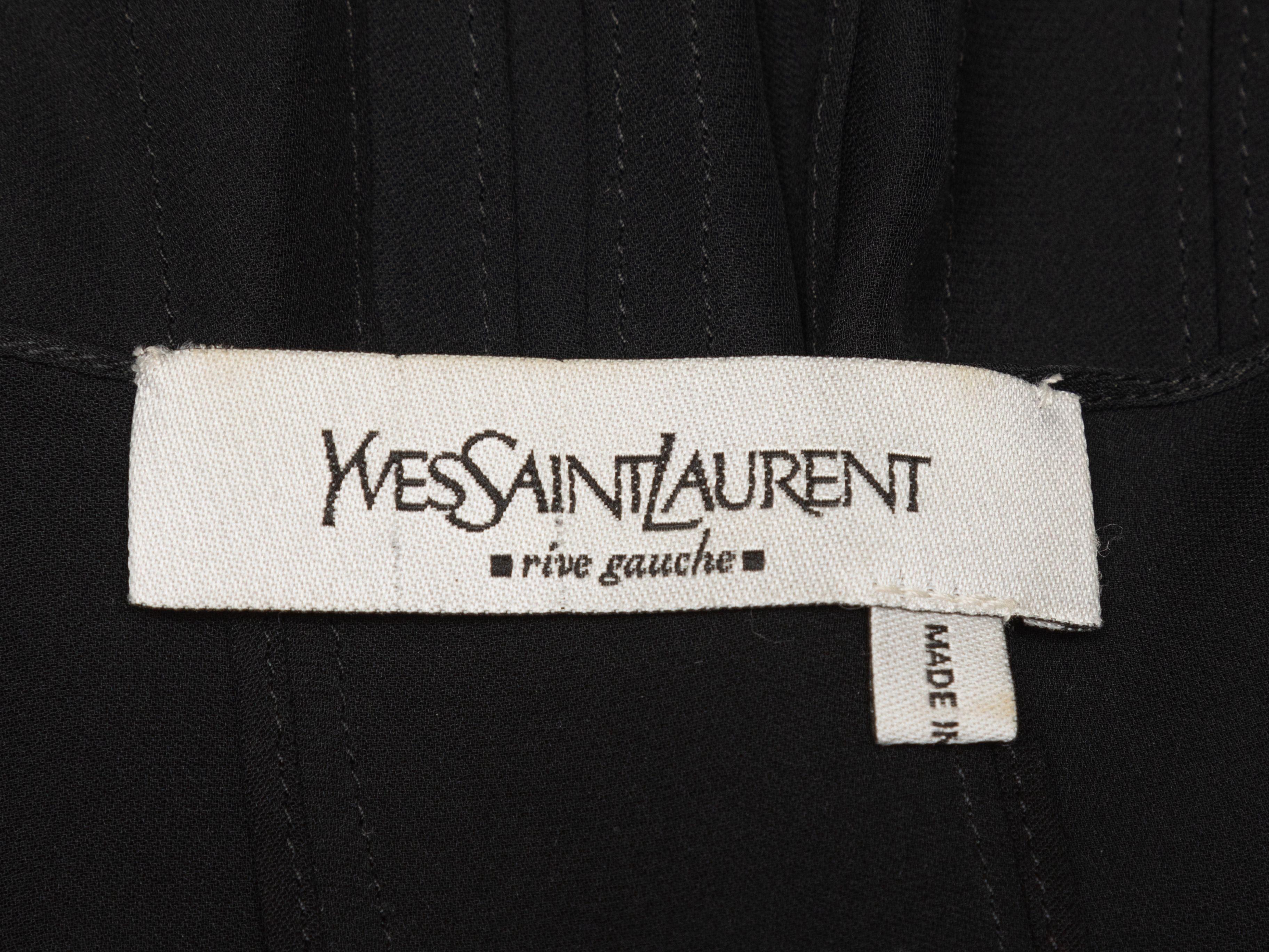 Product Details: Black sleeveless pleated silk top by Yves Saint Laurent. Square neckline. Button closures at center front. Designer size 36. 30