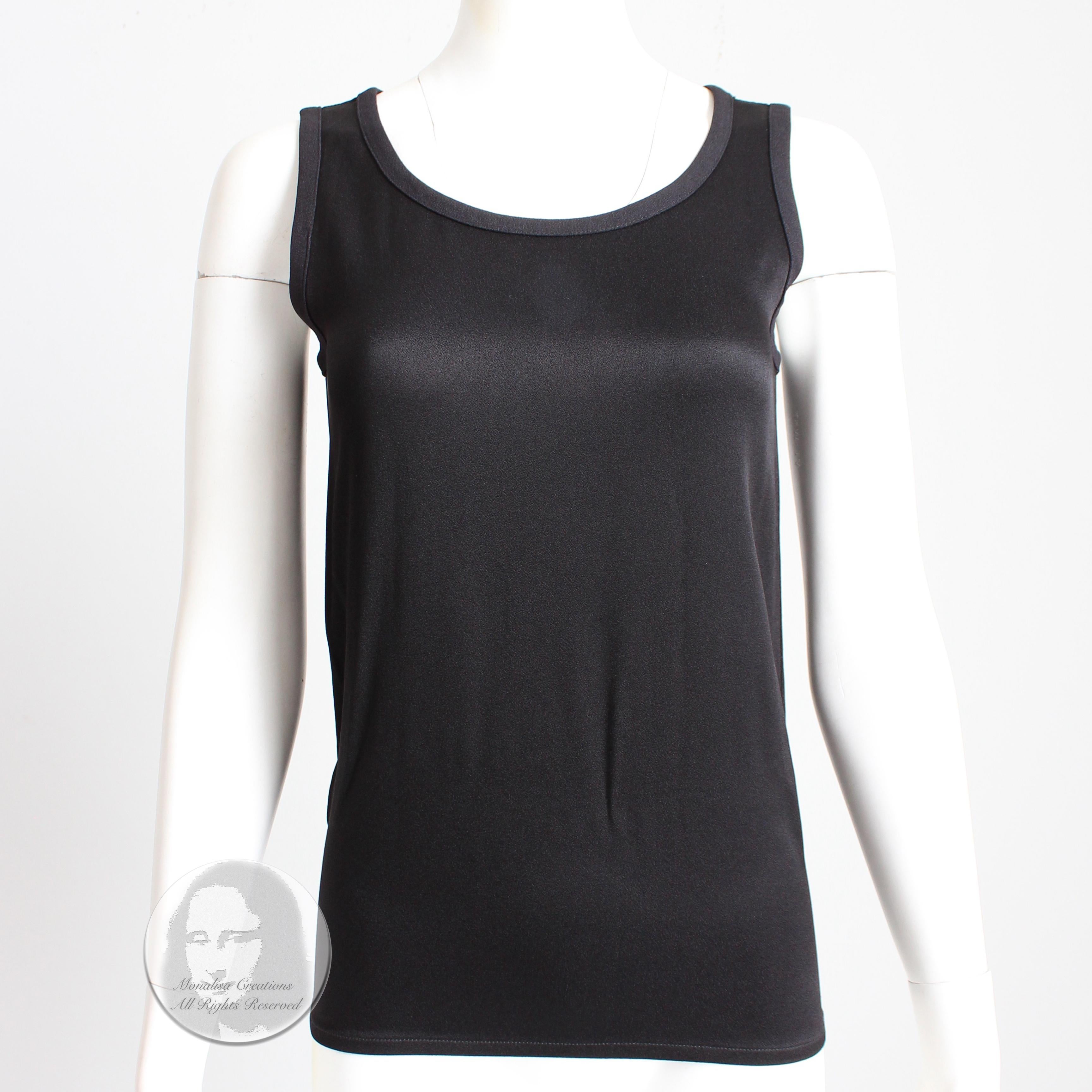 Authentic, preowned, vintage Yves Saint Laurent black sleeveless top, likely made in the 90s. Made from a silky-satin fabric (no content label), it's slightly textured, giving it a really nice sheen!   So easy to wear and style! See our last image,