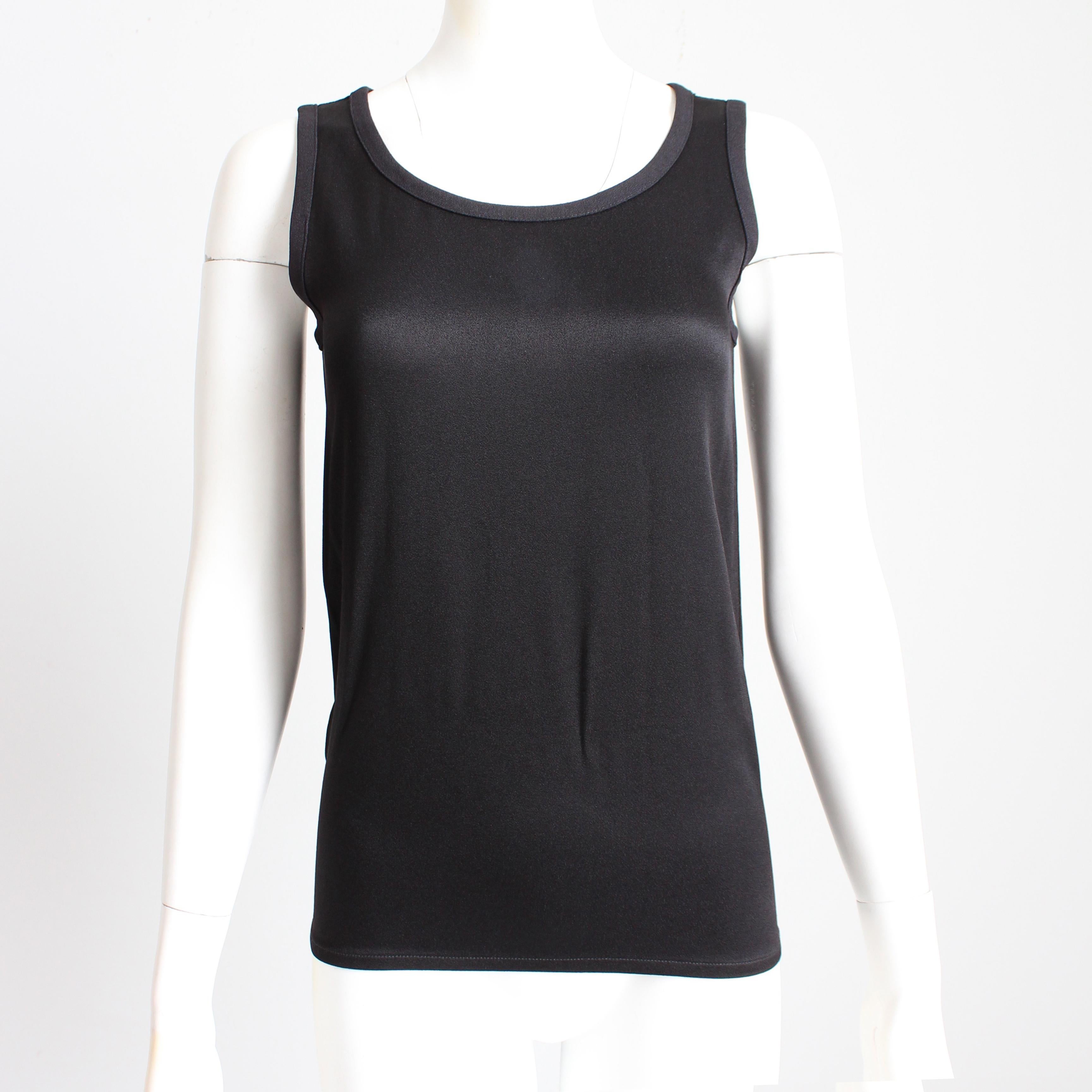 Authentic, preowned, vintage Yves Saint Laurent black sleeveless top, likely made in the 90s. Made from a silky-satin fabric (no content label), it's slightly textured, giving it a really nice sheen!   So easy to wear and style! See our last image,