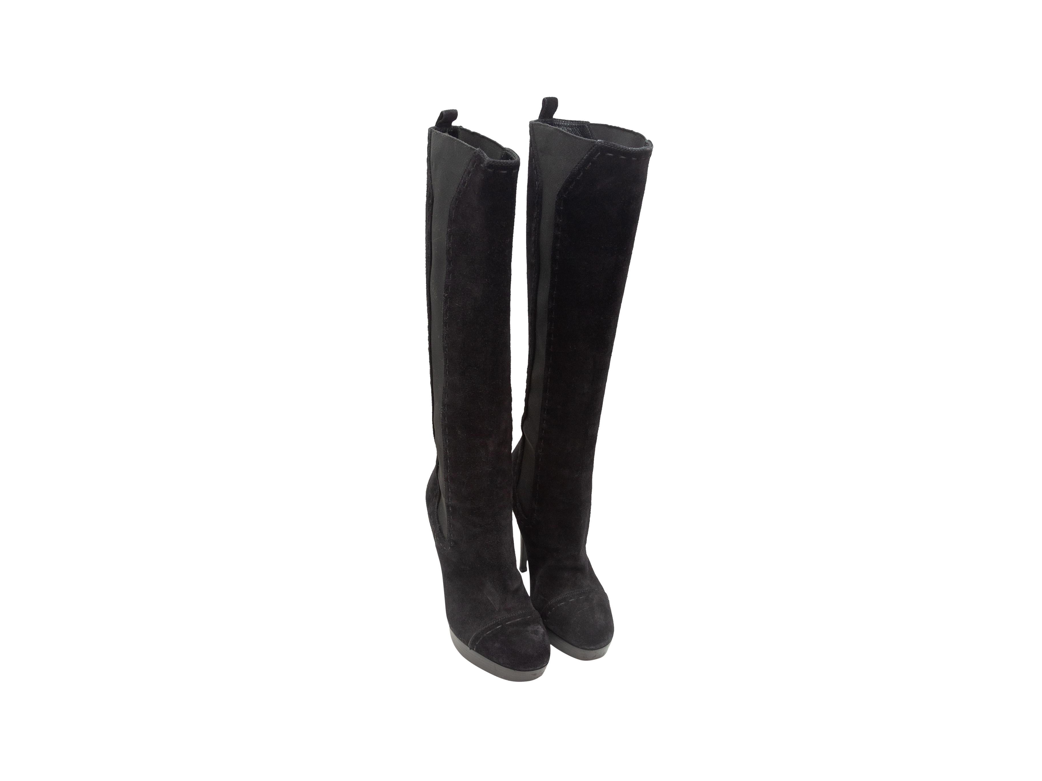 Product details: Black suede platform knee-high boots by Yves Saint Laurent. Stacked heels. Elasticized gores at sides. 5