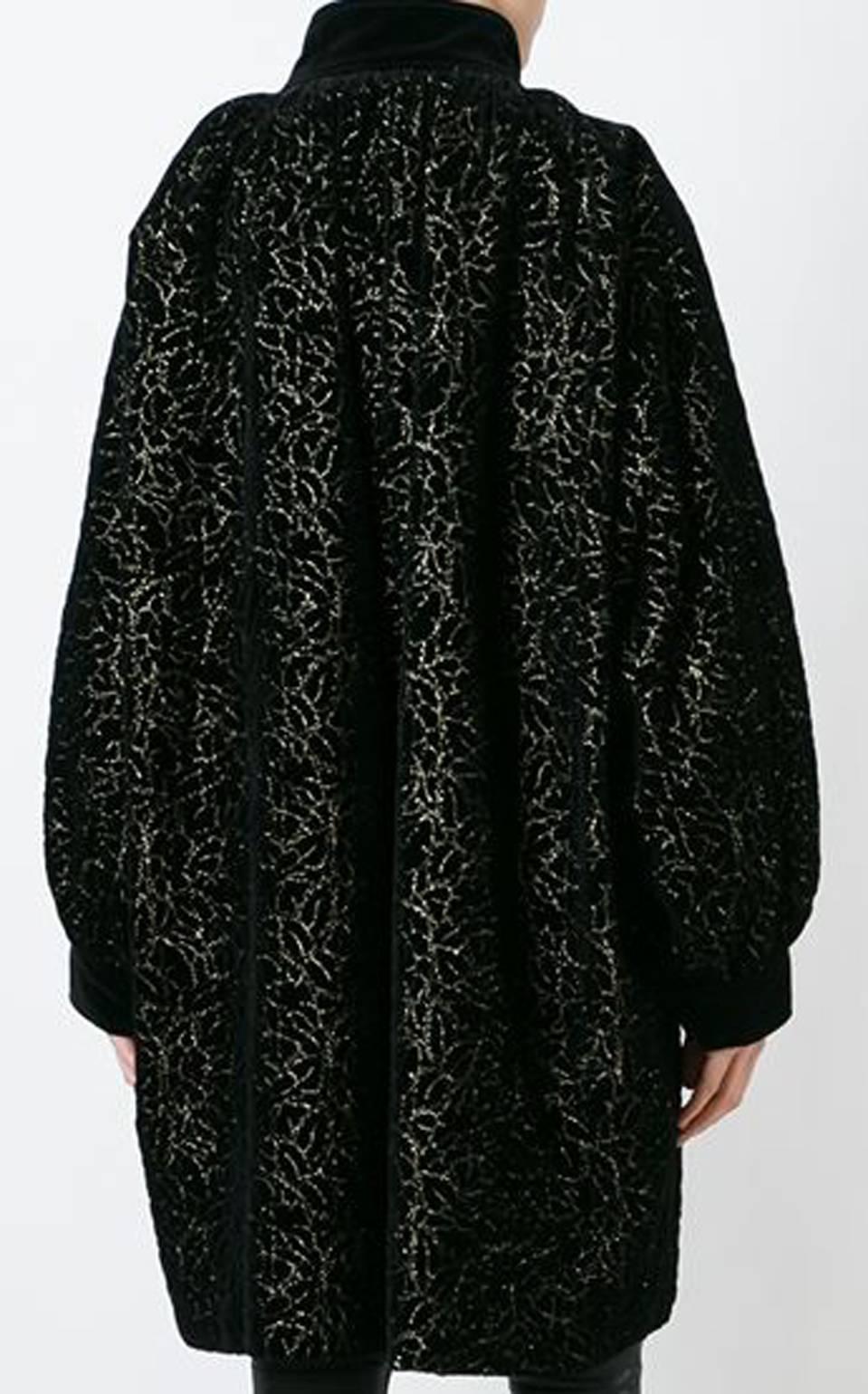 Yves Saint Laurent iconic black and gold-tone cotton floral embroidered velvet coat featuring an oversize cocoon shape, a high standing collar, long sleeves, a front button fastening and side pockets. 
In excellent vintage condition. Made in