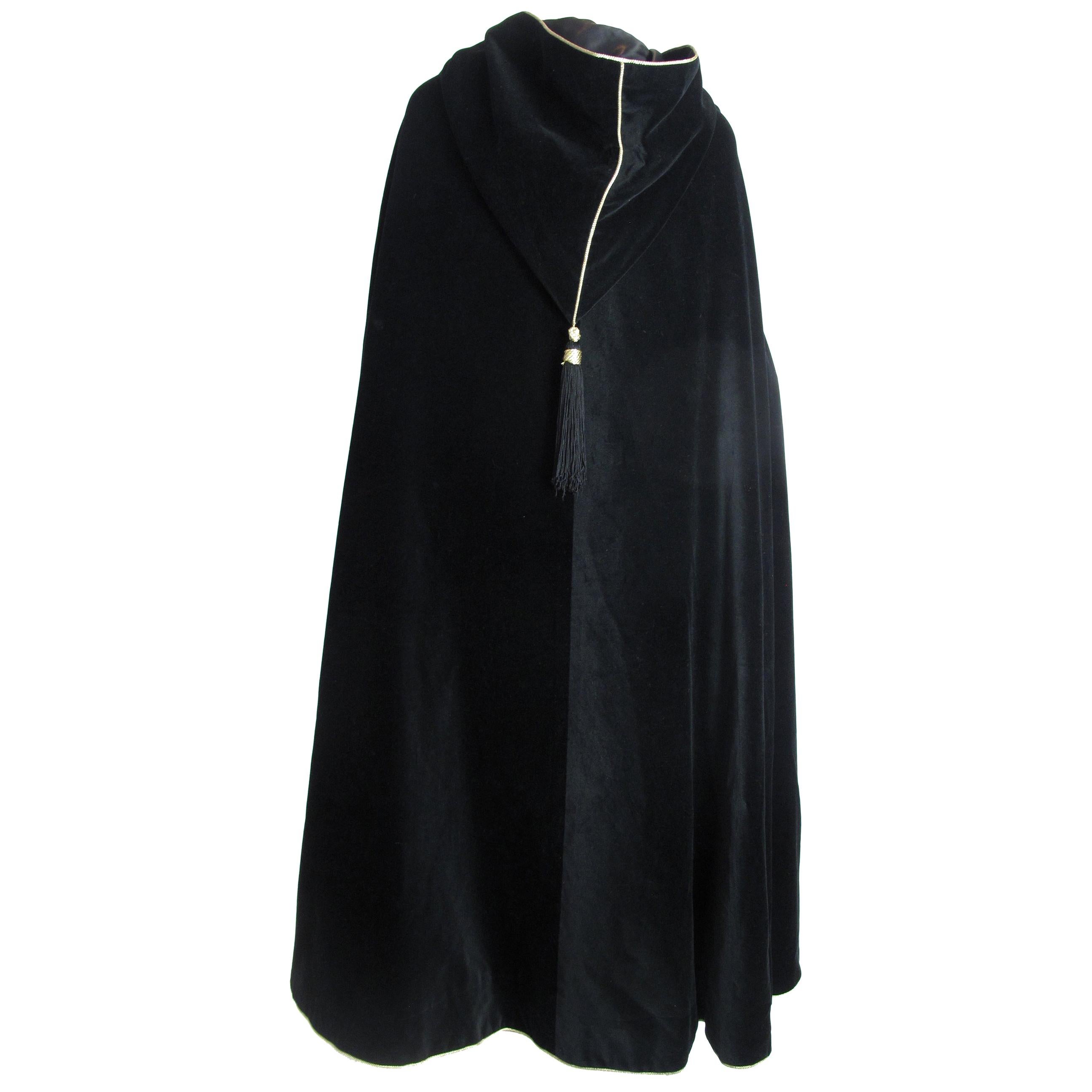 Yves Saint Laurent black velvet hooded cape with tassels. 54