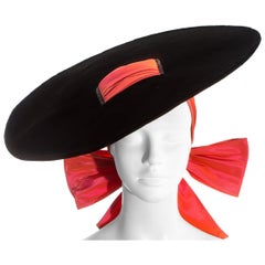 Retro Yves Saint Laurent black velvet saucer hat with orange taffeta ribbon, fw 1995