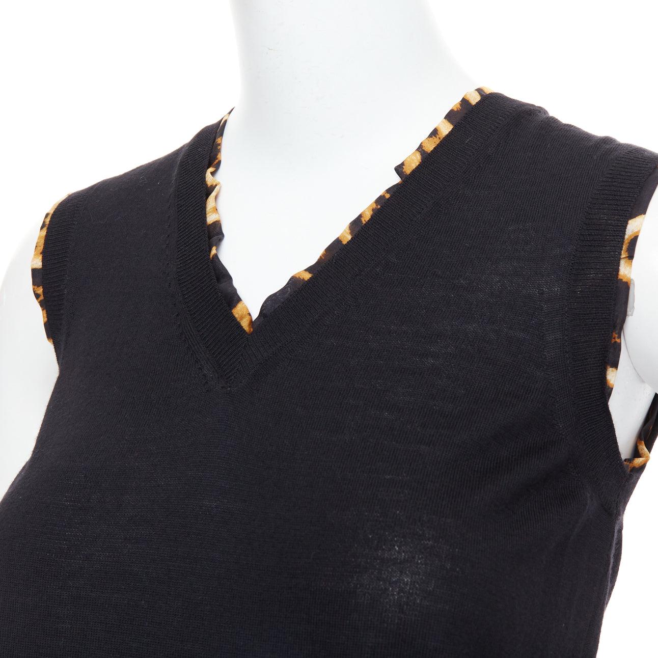 YVES SAINT LAURENT black virgin wool leopard silk trim sweater vest S
Reference: LNKO/A02533
Brand: Yves Saint Laurent
Designer: Stefano Pilati
Material: Virgin Wool, Silk
Color: Black, Brown
Pattern: Leopard
Closure: Pullover
Extra Details: Leopard