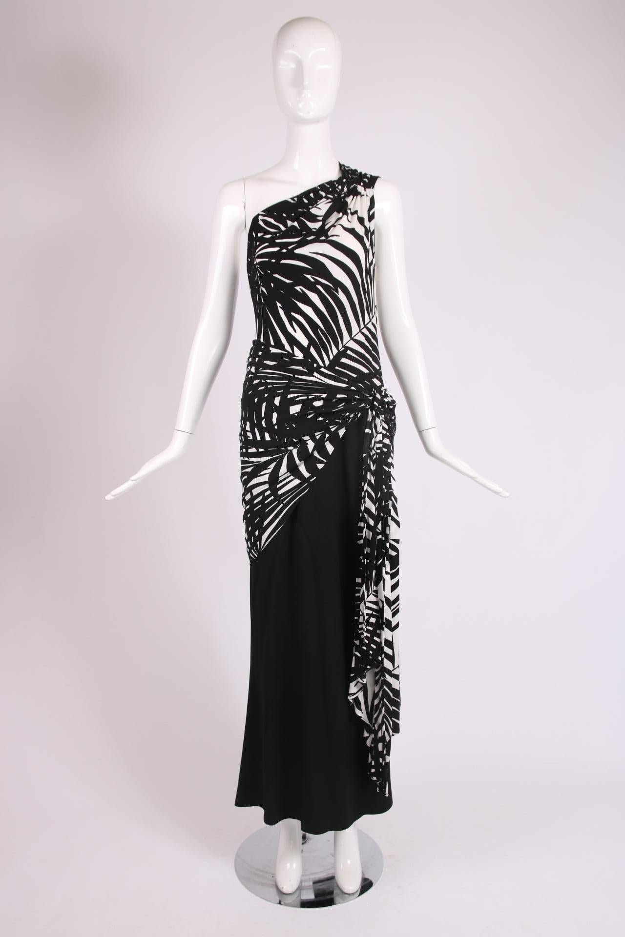 Yves Saint Laurent black and white leaf print silk single shoulder gown with size zipper, fabric that hangs at the side and a black skirt. No fabric tag but feels like some kind of jersey. In excellent condition - size tag 40. Please see