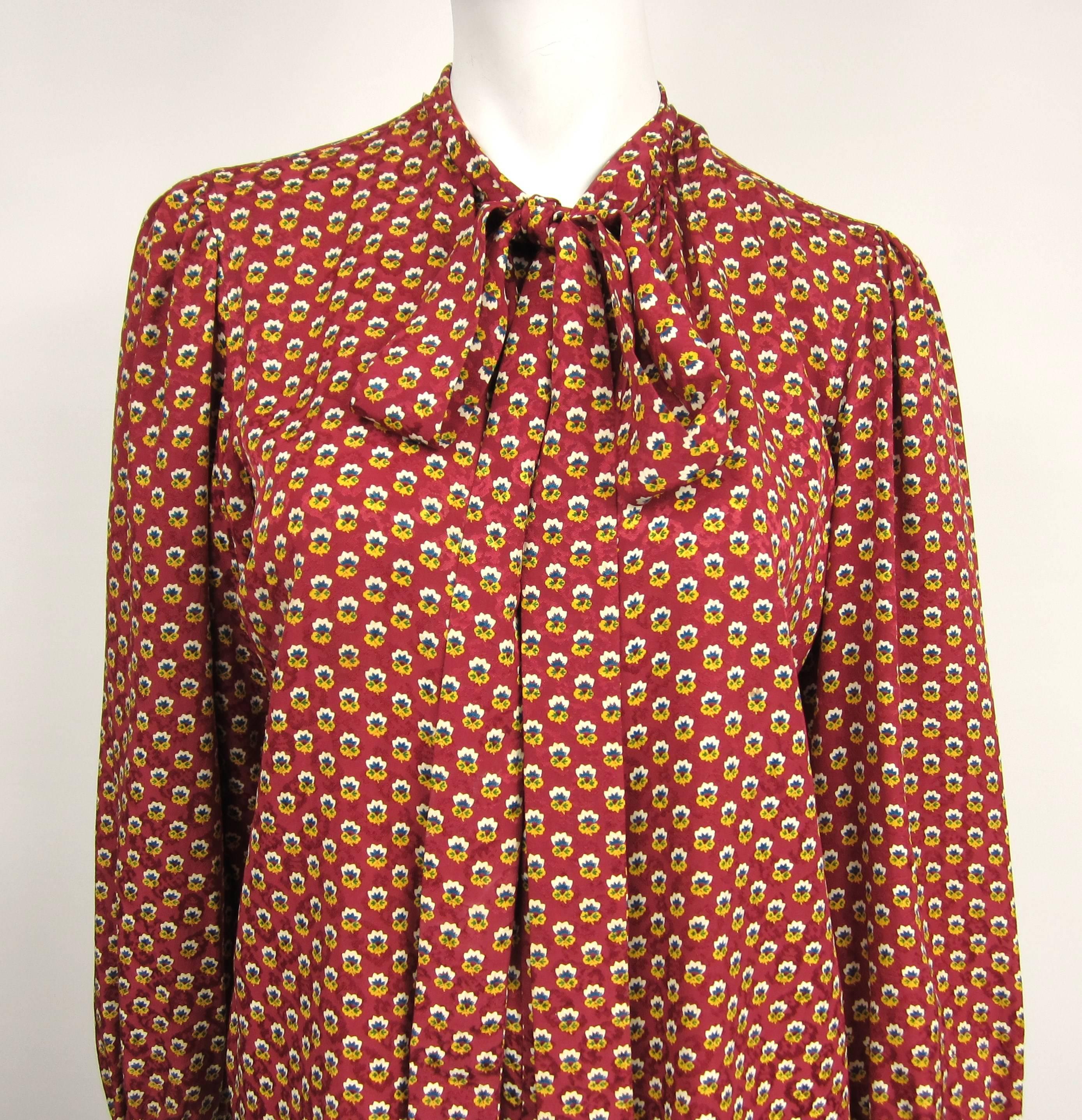 Vintage Late 1960s early 1970s Silk YSL Blouse Top with Hidden button placket. Long attached Scarf, timeless classic. Buttoned cuffs. Measuring Up to 38 in. chest -- Up to 38 in. waist - Sleeve 24 in. -- Collar 1.5-- Length down the front 23 in.