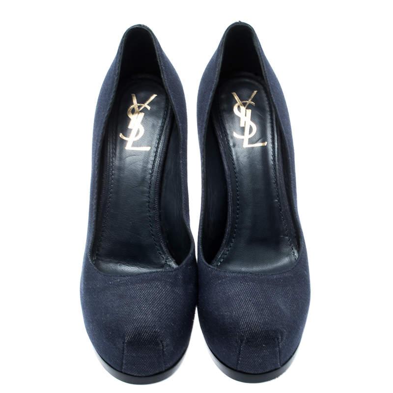 Create a unique look by combining your traditional outfit with this pair of gorgeous Yves Saint Laurent pumps. Stay updated with the latest fashion trends by donning these denim pumps featuring platforms and 11.5 cm heels.

