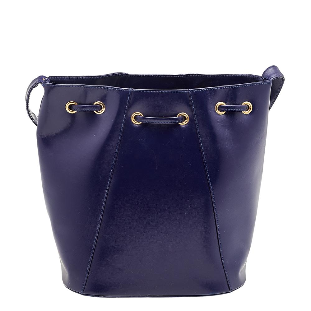 Yves Saint Laurent's bags are every fashionista's dream come true. This bag is carefully created from blue leather into an exquisite bucket design. It has a shoulder strap and a leather interior offering enough storage for everyday essentials.