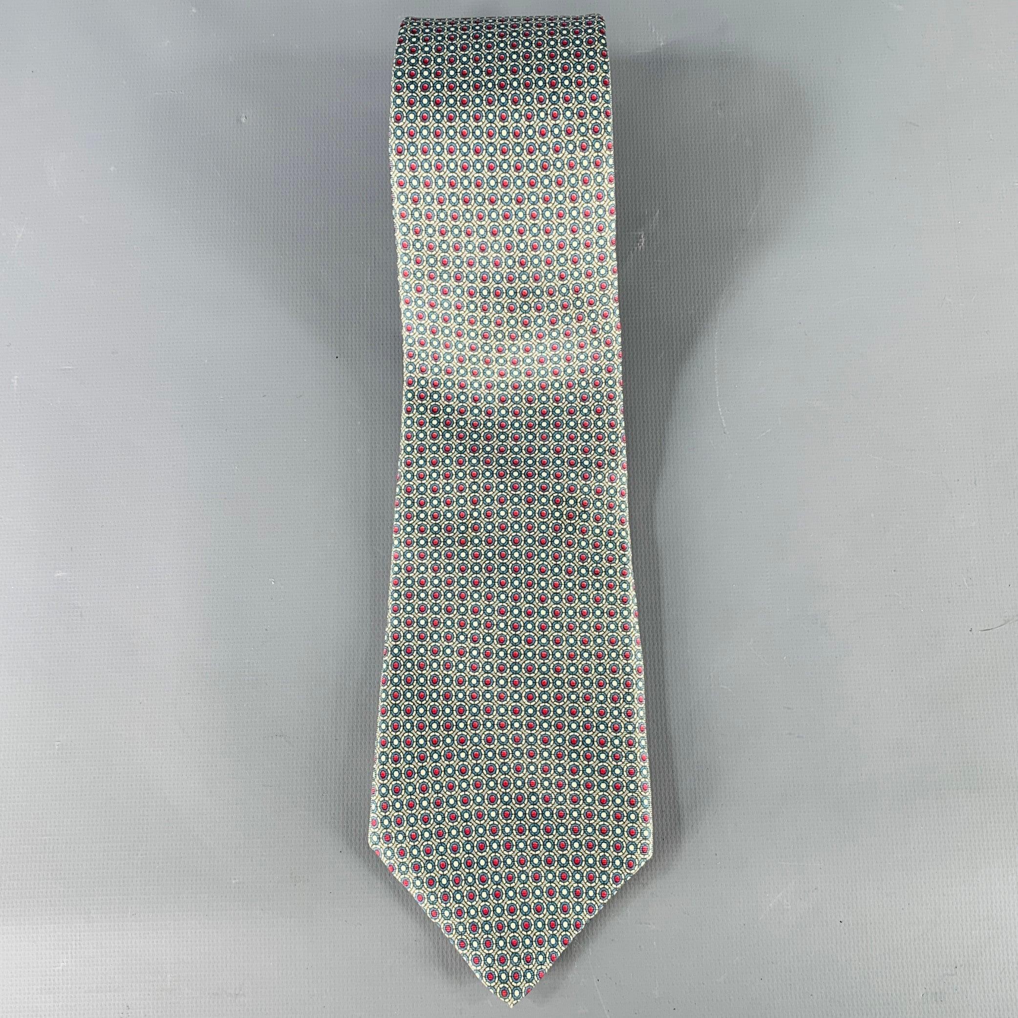 YVES SAINT LAURENT necktie
in a blue and red silk featuring a circles pattern. Made in USA.Excellent Pre-Owned Condition. 

Measurements: 
  Width: 3.5 inches Length: 57 inches 
  
  
 
Sui Generis Reference: 135443
Category: Tie
More Details
   