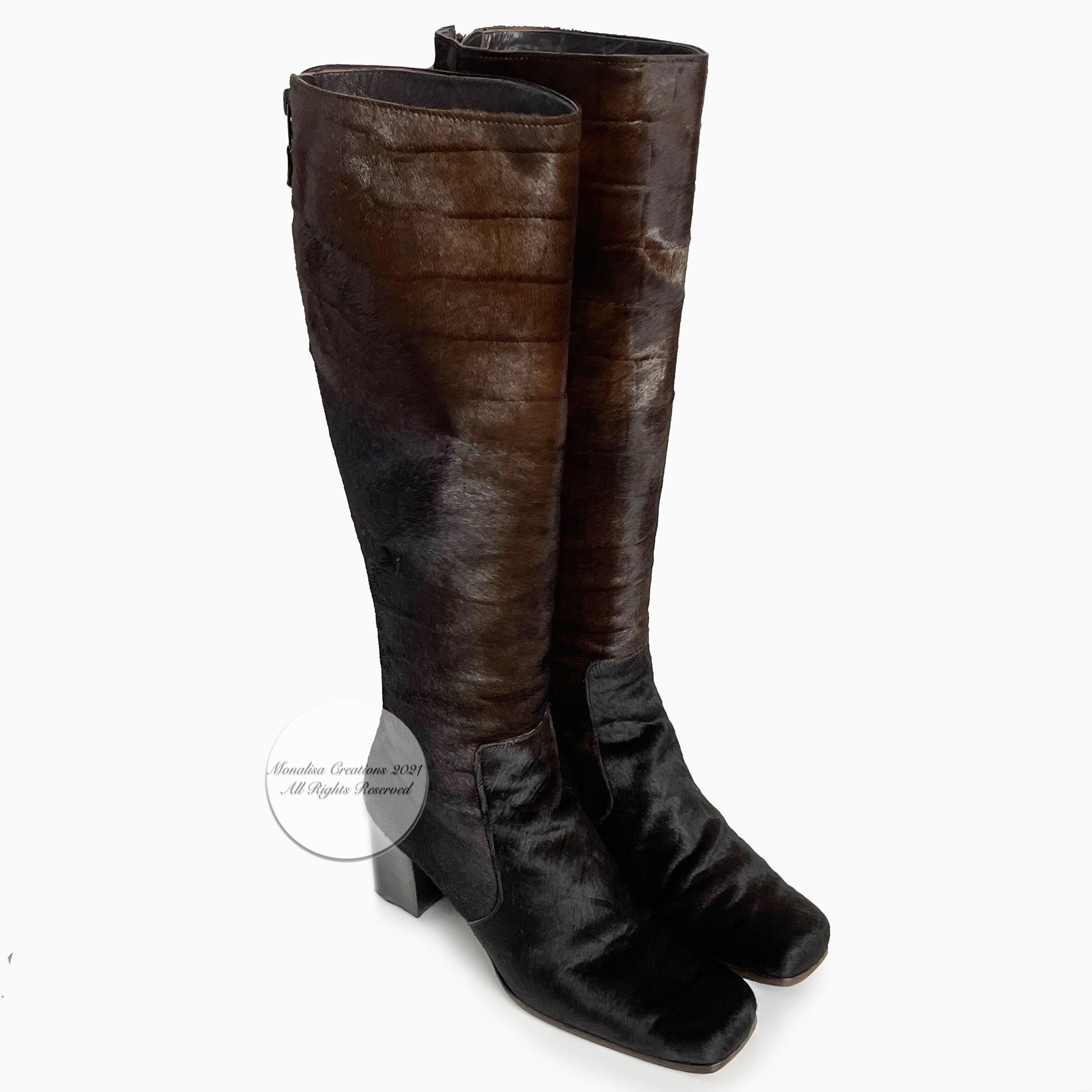 Yves Saint Laurent knee high boots in a rich brown croc-textured pony, made in Italy, most likely in the 70s.  Rear zipper entry, square toe and heels.   Iconic style, the texturing on the brown pony is fabulous (see image 7 where we've purposely
