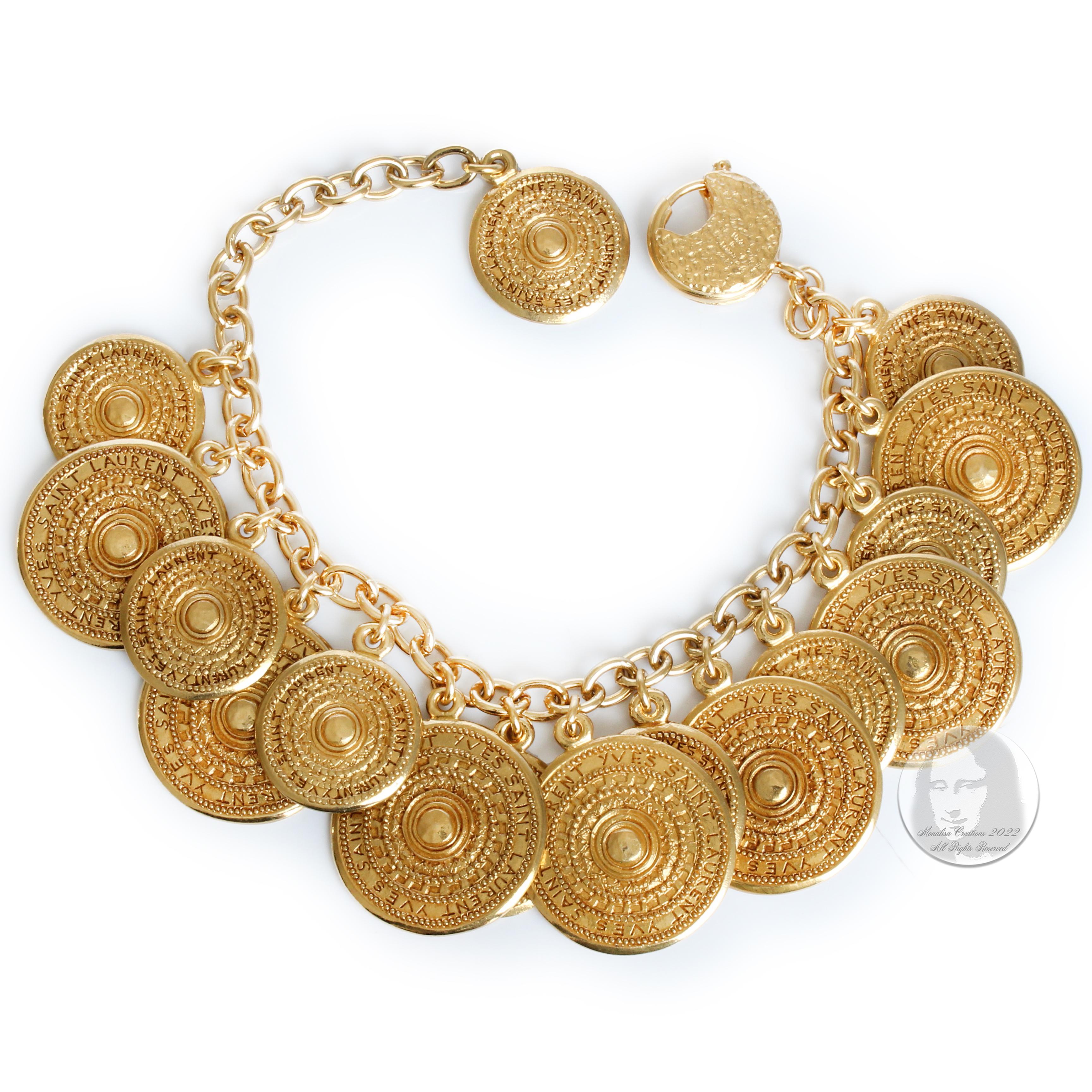 Authentic, preowned, vintage Yves Saint Laurent coin bracelet, most likely made between the late 70s and mid 80s.  A similar style coin necklace was worn by actress Farrah Fawcett for Vogue Magazine in 1977.  Made from gold metal, each coin