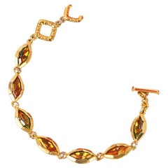 Vintage Yves Saint Laurent Bracelet in Gold-Plated Metal and Orange Rhinestones