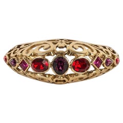 Bracciale Yves Saint Laurent in metallo dorato e strass