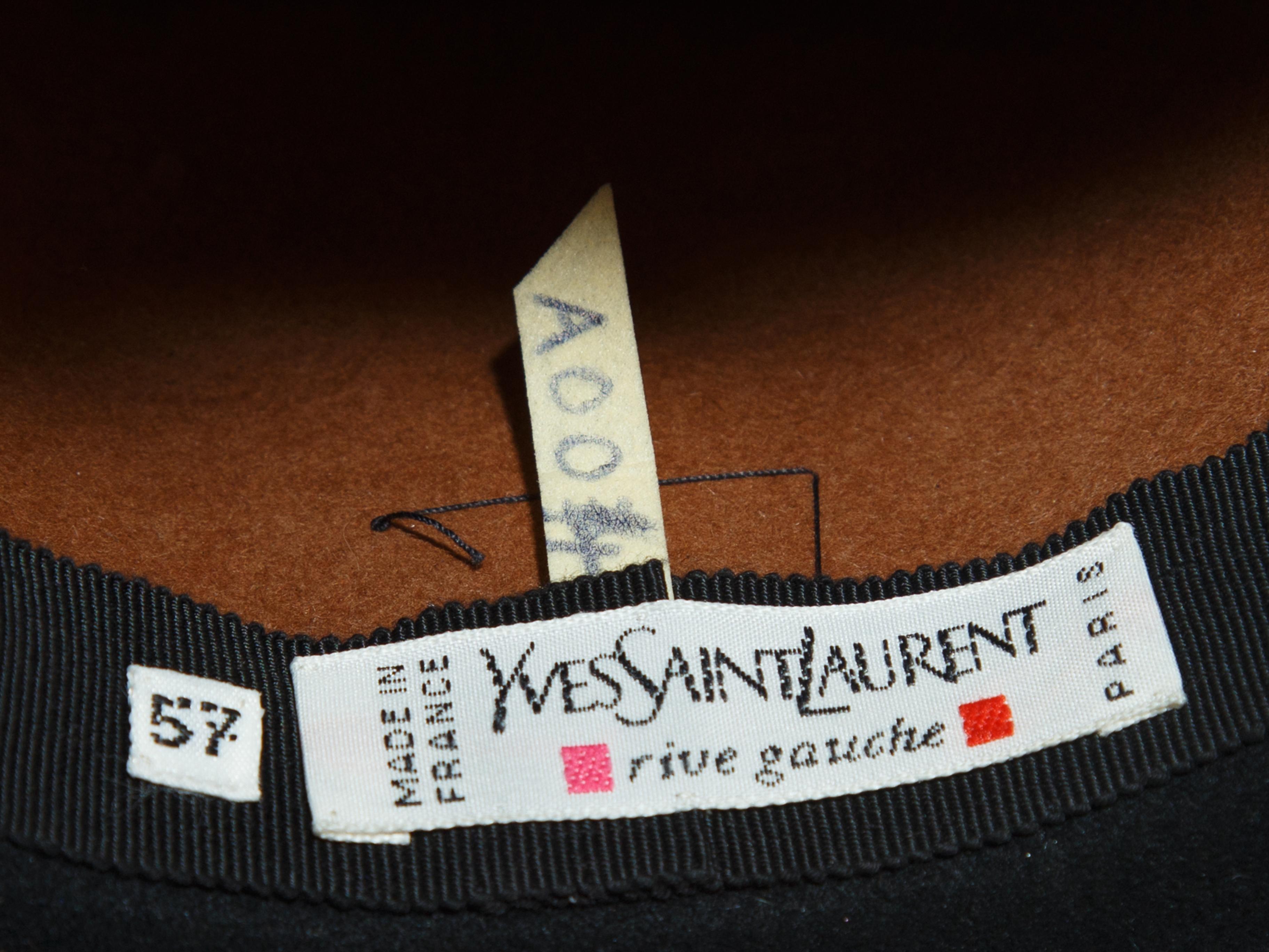 Product details: Vintage brown and black felt hat by Yves Saint Laurent. Black fringe trim at brim. Designer size 57. 12