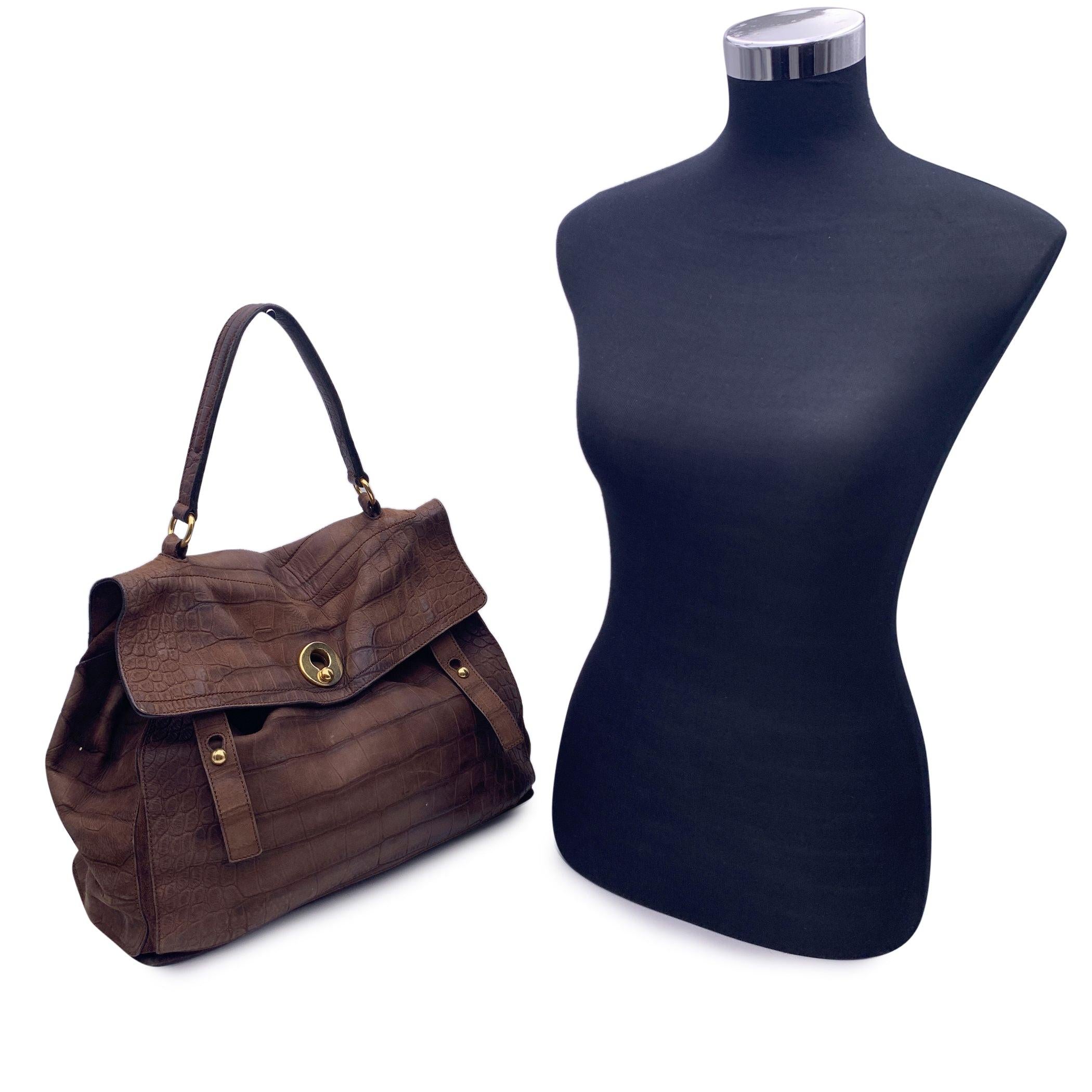 Yves Saint Laurent Medium 'Muse 2 Two' bag, crafted in brown embossed leather and beige canvas. The bag features flap closure, top carry handle, gold metal hardware, 5 protective bottom feet.1 rear pocket. Suede lining. 2 main compartment and 1