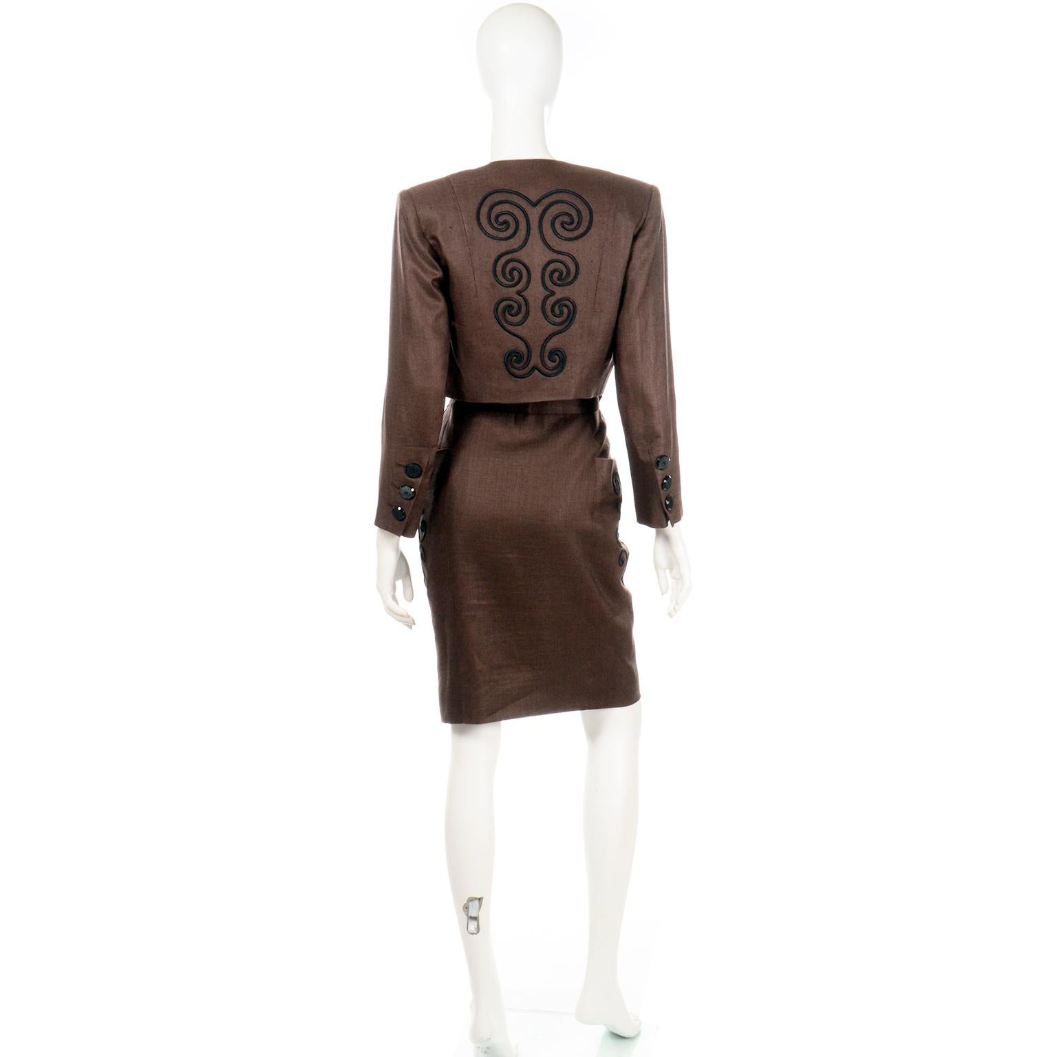 This is a 1980's vintage Yves Saint Laurent 2 piece brown linen jacket and skirt suit. The luxe brown fabric feels like a rayon linen blend and has brown lining and black buttons. We especially love the detailed black soutache style embroidery trim