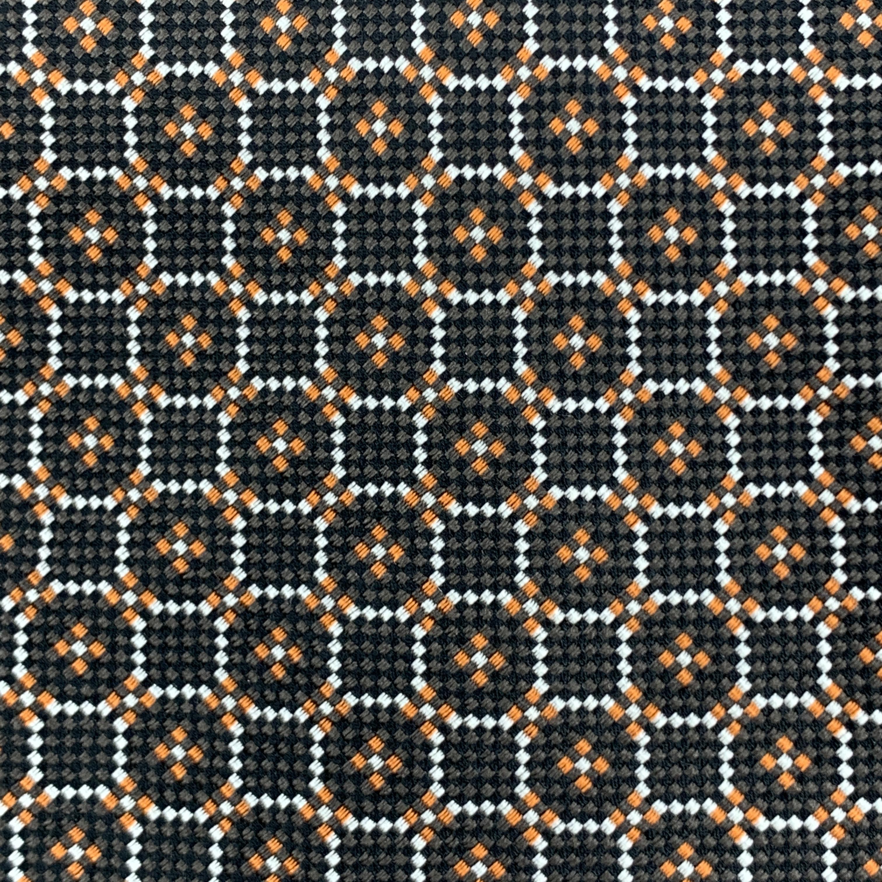 Archive YVES SAINT LAURENT Rive Gauche necktie comes in brown woven silk with all over orange and white circle pattern. Made in Italy.

Excellent Pre-Owned Condition. 

Width: 3.75 in.