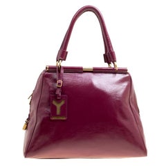 Yves Saint Laurent, borsa media Majorelle in pelle verniciata bordeaux
