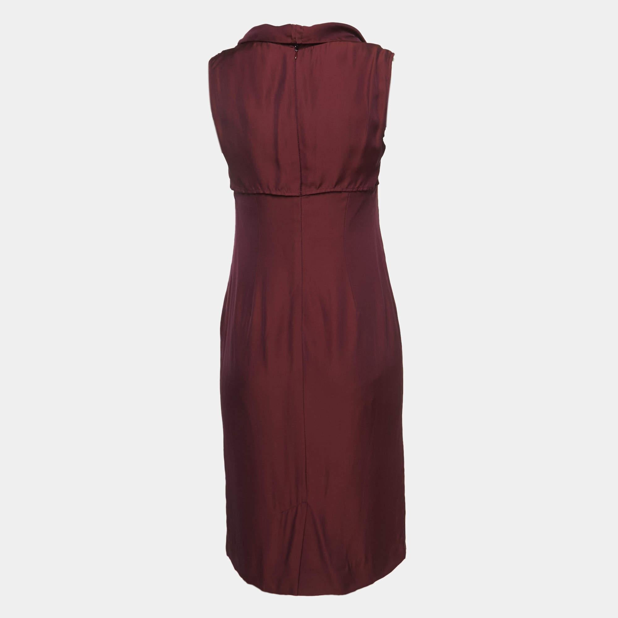 Step into timeless elegance with this YSL dress. Meticulously crafted it embodies grace and sophistication making it the perfect choice for those seeking an exquisite wardrobe addition.