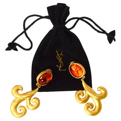Orecchini a clip in ambra e oro vintage anni '80 firmati Yves Saint Laurent by Gripoix