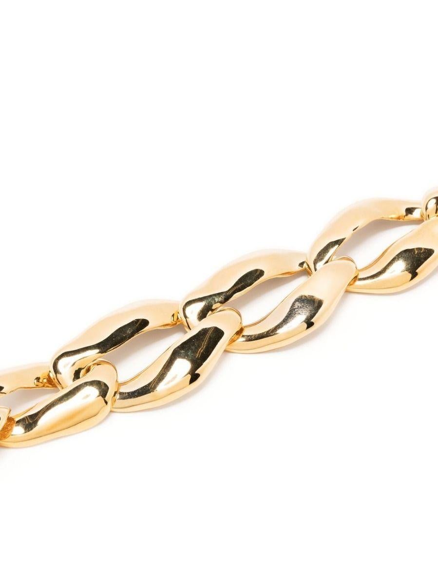 Designed by Robert Goosens for Saint Laurent, this bold necklace has been crafted from large gold-tone curb links and is finished with a hook fastening that can be adjusted to your desired length. It looks just as chic styled with a cashmere sweater