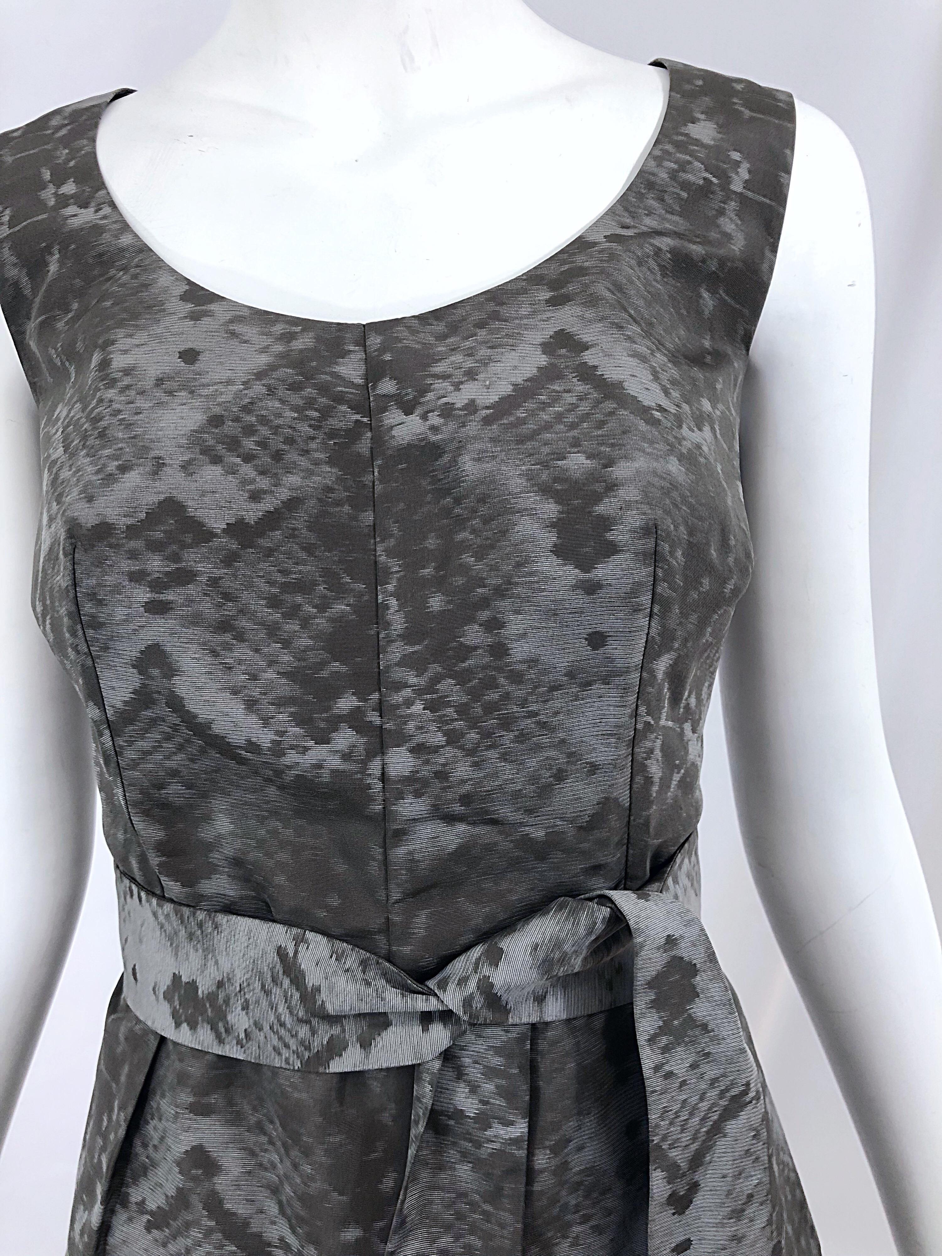 Chic never worn YVES SAINT LAURENT YSL gray snakeskin print silk blend belted sleeveless dress! Fitted bodice with a flattering bubble like skirt. POCKETS at each side of the hips. Detachable belt. Hidden zipper up the back with hook-and-eye