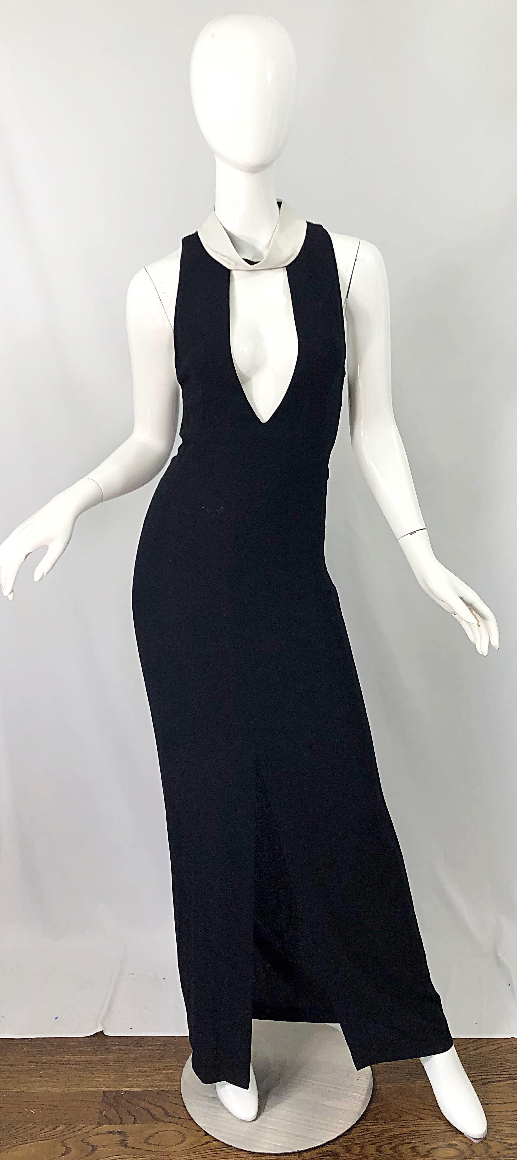 Sexy and highly collectible museum quality vintage YVES SAINT LAURENT YSL by TOM FORD black and white plunging runway cut-out gown ! Features a soft crepe blend fabric that hugs the body beautifully. Plunging neckline with a white funnel like