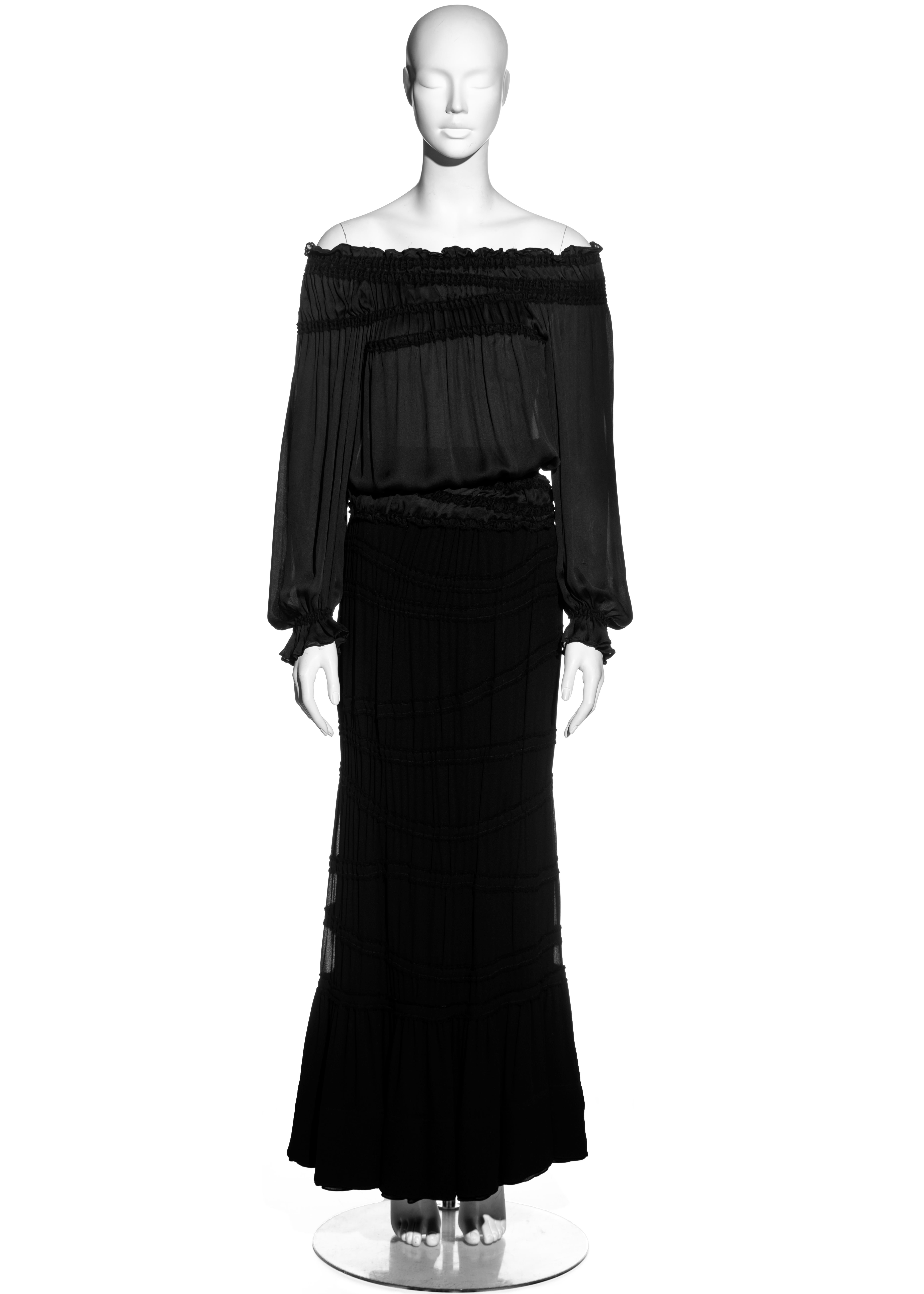 ▪ Yves Saint Laurent black silk poet blouse and maxi skirt set
▪ Designed by Tom Ford
▪ 100% Silk 
▪ Off shoulder poet blouse with elastic shirring 
▪ Shirred maxi crepe skirt with pleated layered hem 
▪ IT 38 - FR 34 - UK 6 - US 4
▪ Fall-Winter 2001