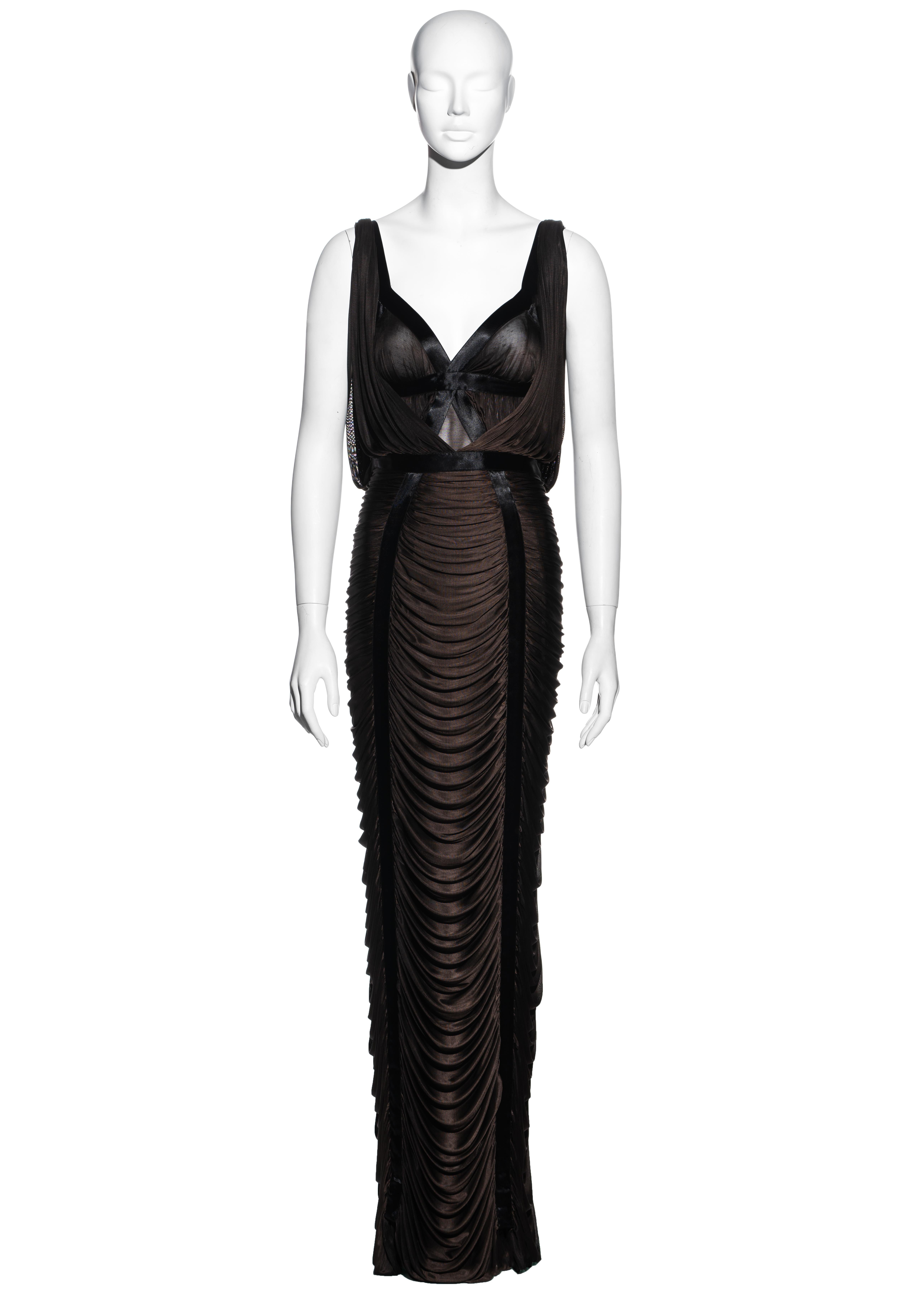 ▪ Yves Saint Laurent brown draped evening maxi dress
▪ Designed by Tom Ford
▪ Black silk ribbon 
▪ Draped detail on skirt 
▪ Size Small
▪ Spring-Summer 2003