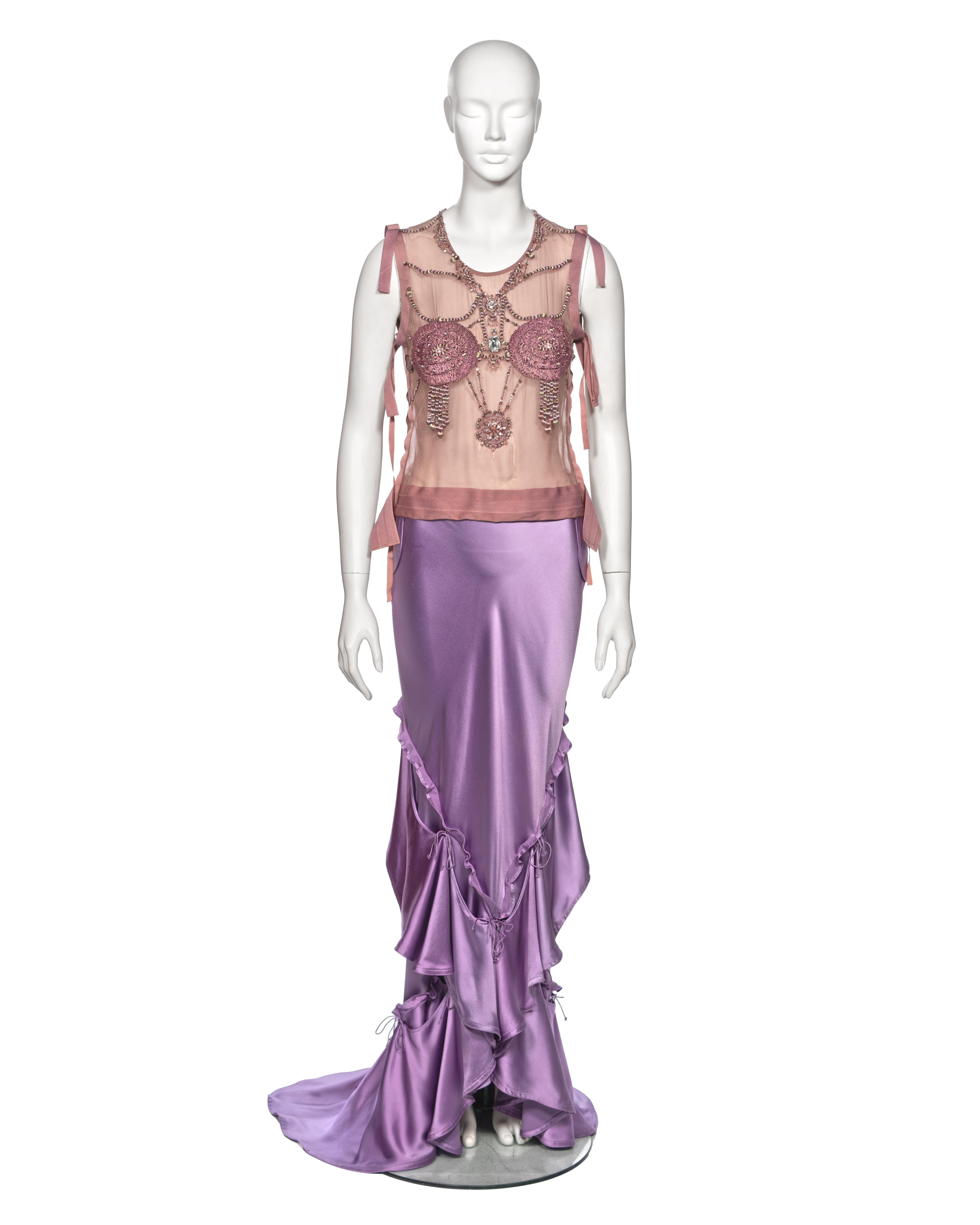 ▪ Archival Yves Saint Laurent Runway Evening Ensemble
▪ Creative Director: Tom Ford
▪ Fall-Winter 2003
▪ Sold by One of a Kind Archive
▪ Crafted from fine dusty pink silk tulle, this embellished evening top features intricate embroidery with tonal