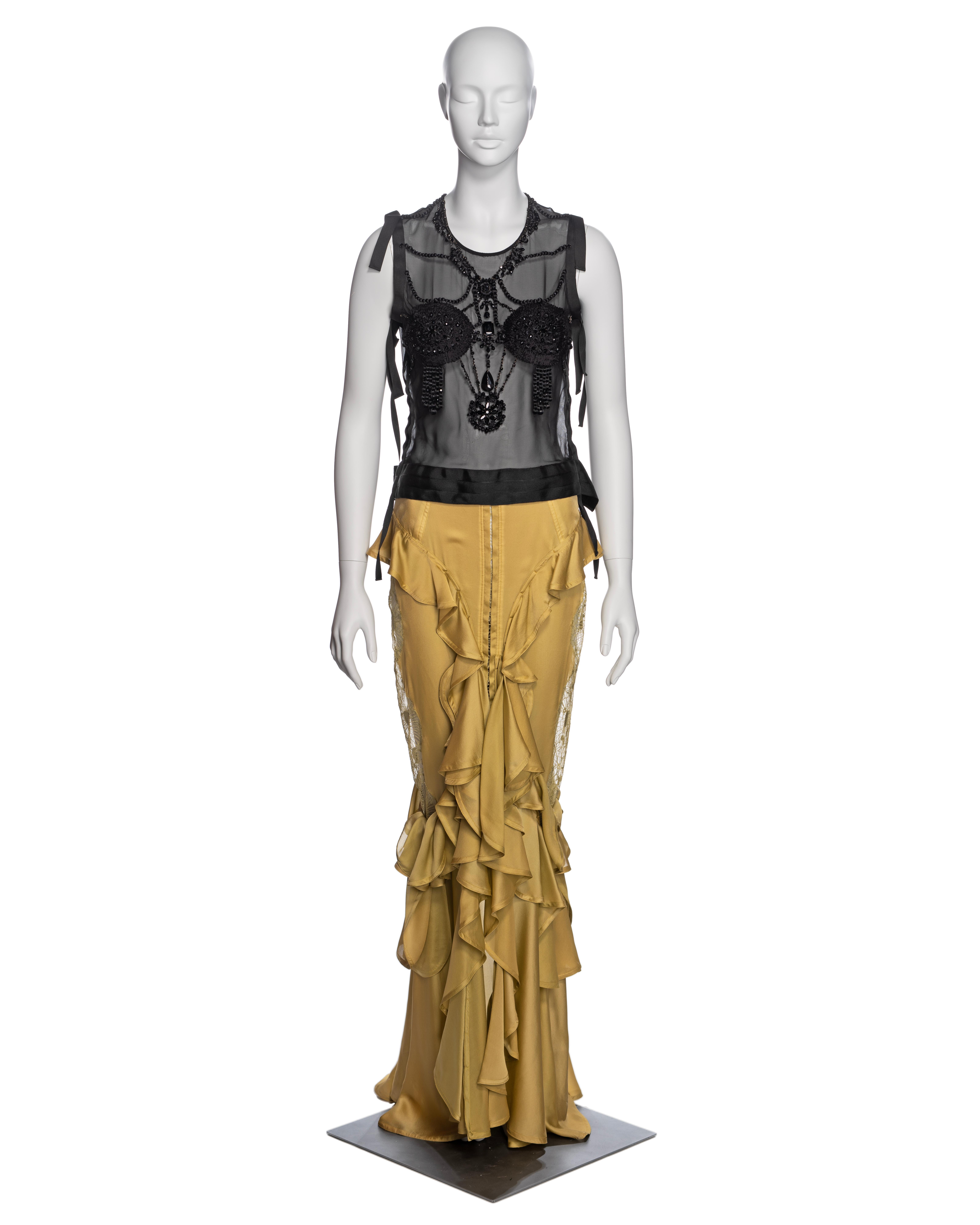 ▪ Brand: Yves Saint Laurent
▪ Creative Director: Tom Ford
▪ Collection: Fall-Winter 2003
▪ Fabric: Silk
▪ Details: The top in a black silk net with grosgrain ribbon trim, adorned with silk thread beads, crystals and seed beads. The Skirt in a