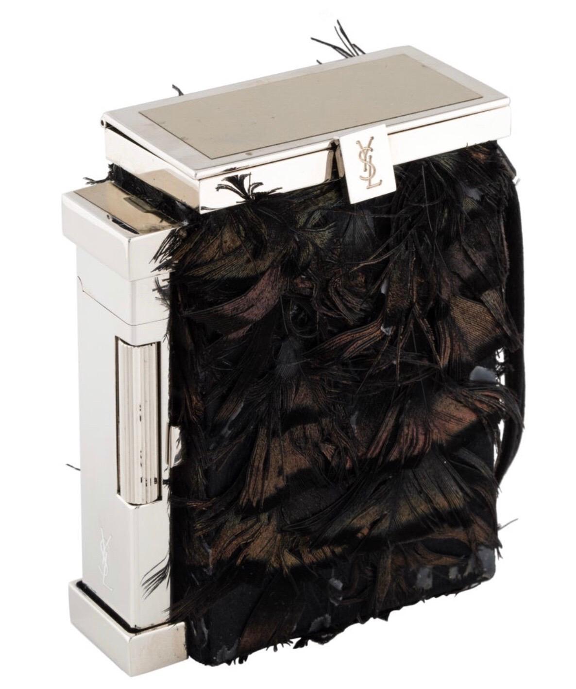 Yves Saint Laurent by Tom Ford feathered case with lighter. Condition: Good, some feather loss, needs butane. Includes dust bag and box.
