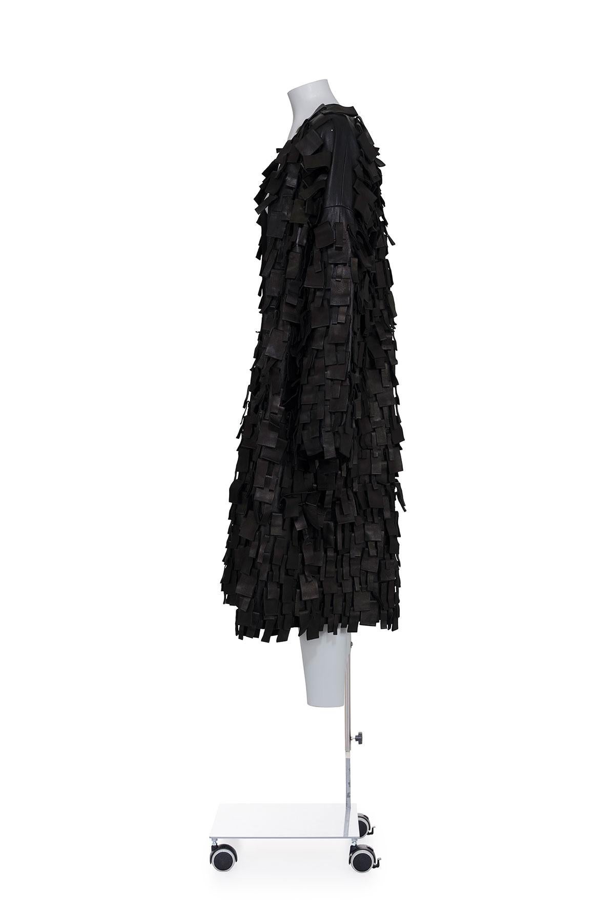 Fall Winter 2002 iconic and rare leather coat by Tom Ford for Yves Saint Laurent
Oversize folded fringes with studs
The composition is 100% leather