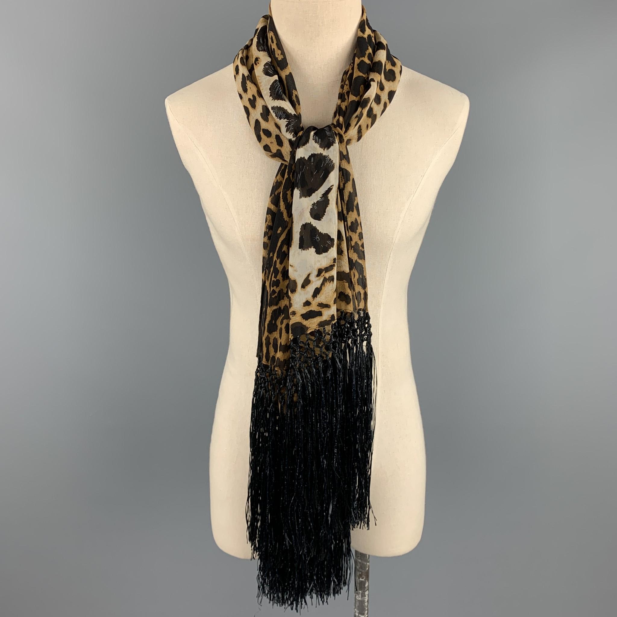 YVES SAINT LAURENT by TOM FORD scarf comes in brown & tan leopard print silk with a twelve inch fringe trim. Made in Italy. 

Excellent Pre-Owned Condition:

Measurements:

56 in. x 26 in. 
