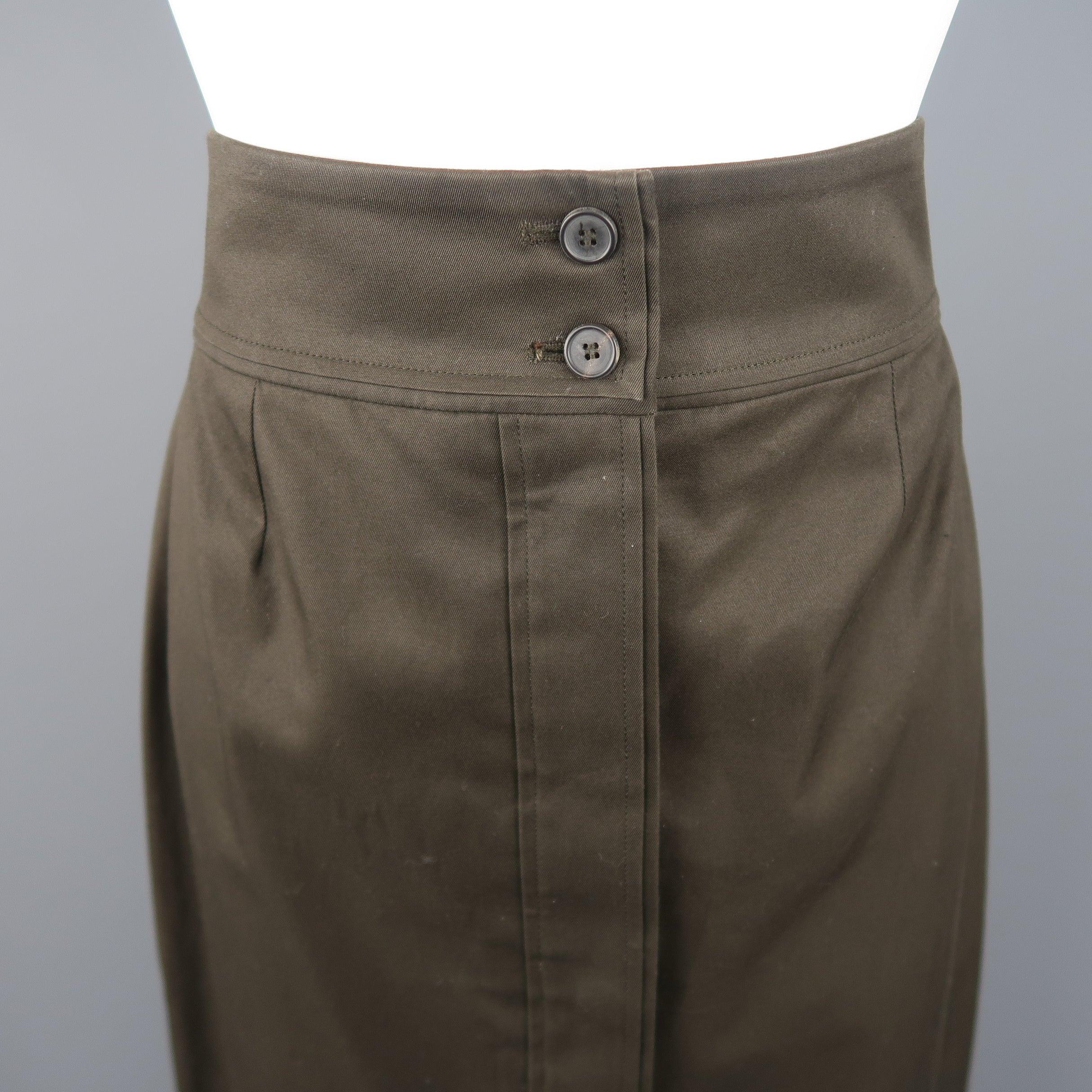 YVES SAINT LAURENT by TOM FORD Rive Gauche pencil skirt, come in cotton in dark green tone, with button frontal closure, pale waist and pleat details. Made in France. 
Good Pre-Owned Condition.
 

Marked:   FR 40
 

Measurements: 
  
Waist: 29