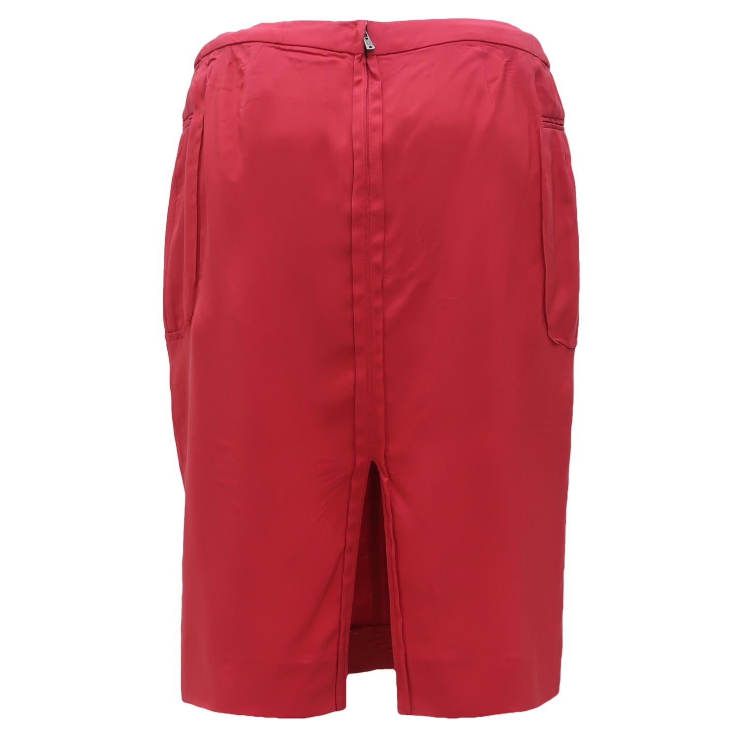 Straight skirts are a Saint Laurent staple and they were famously worn with broad shouldered blazers or pussy-bow blouses from the late 1970s to the early 1990s. This unusual red skirt plays with the menswear idea and also hints at sartorial