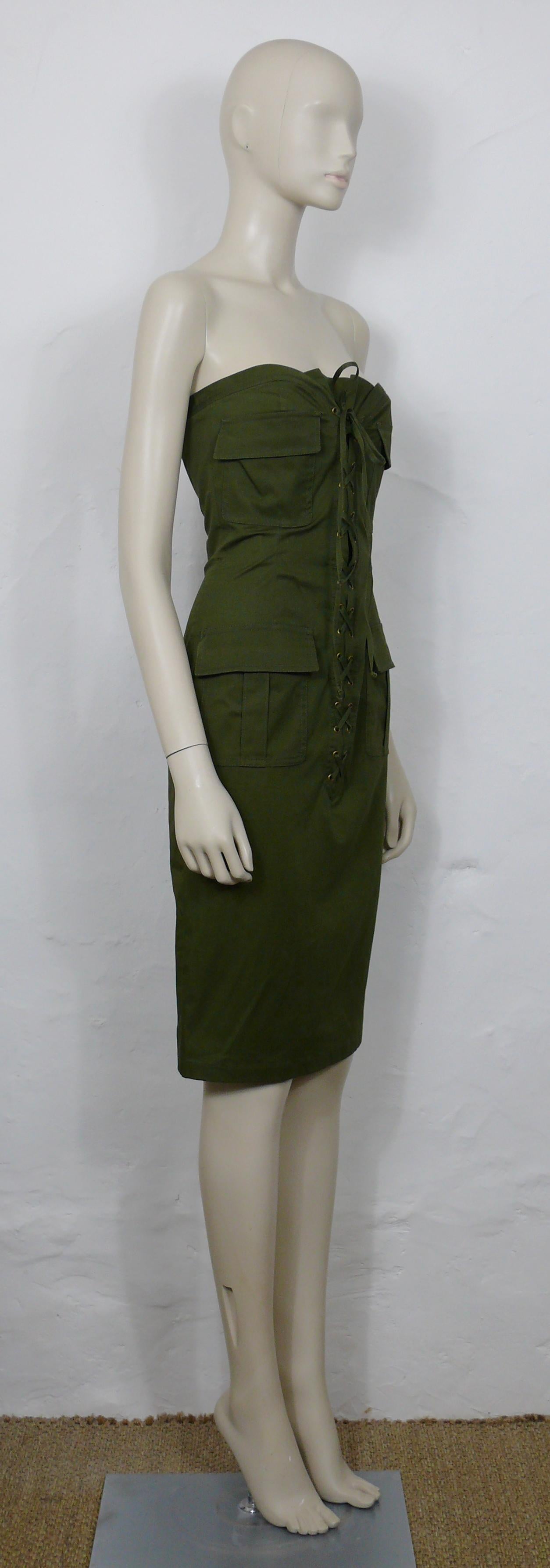 YVES SAINT LAURENT by TOM FORD khaki color strapless safari dress with a built in bustier bra.

This dress features :
- Khaki cotton blend fabric.
- Built in bustier bra.
- Four patch pockets.
- Front lacing.
- Side hidden zippered closure.
- Bronze